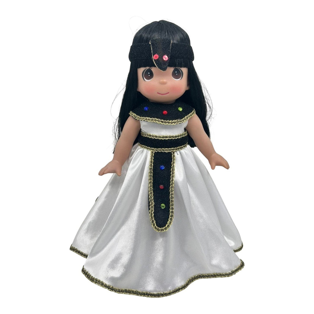 The Doll Maker 12-inch Egyptian doll with black hair, wearing a white satin dress with gold trim and jewel accents.