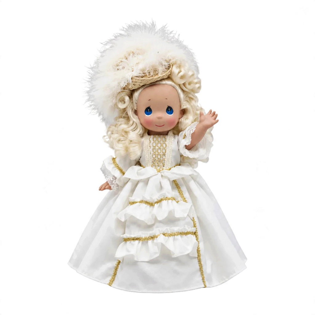 The Doll Maker 12-inch Elegant France doll in a white gown with gold trim and a large feathered hat