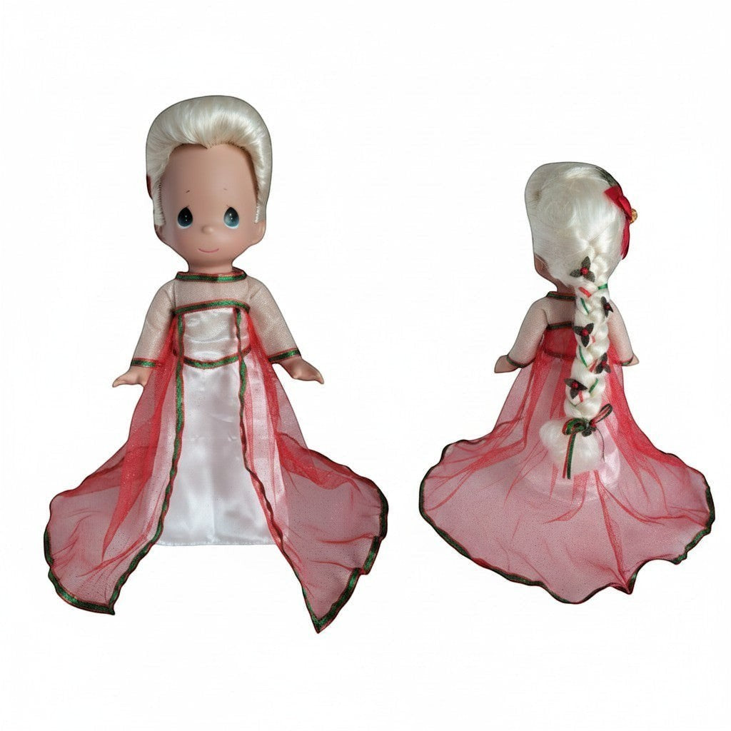 The Doll Maker Elsa Queen 12-inch doll with blonde braided hair, wearing a white satin gown with red tulle overlay.