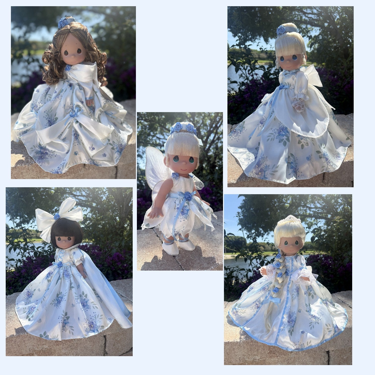 The Doll Maker 12 inch princess dolls in white and blue floral gowns with fairy wings and elegant hair accessories.