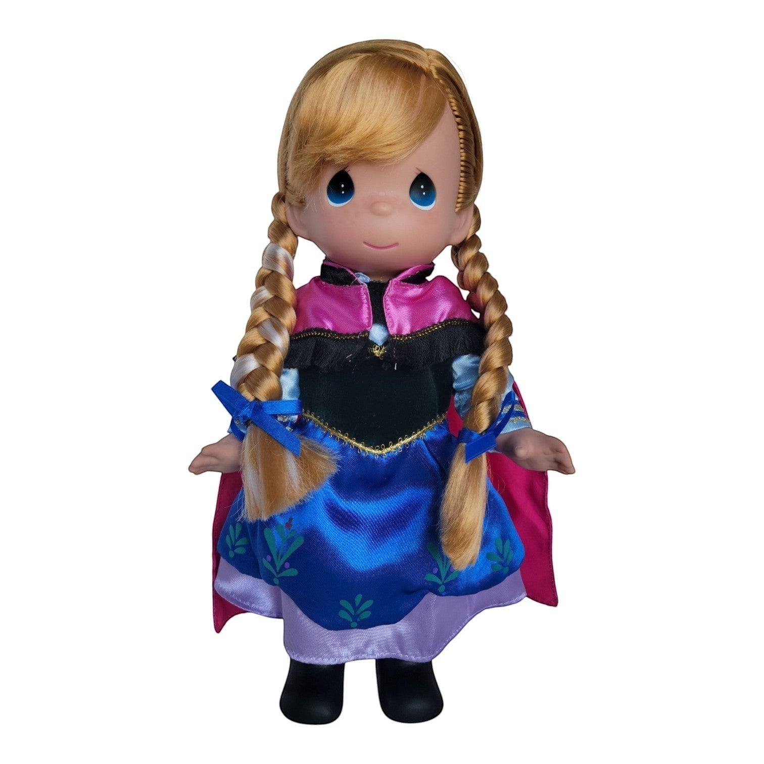 The Doll Maker 12-inch Frozen Princess Anna collectible doll with braided hair and dress with a cape.