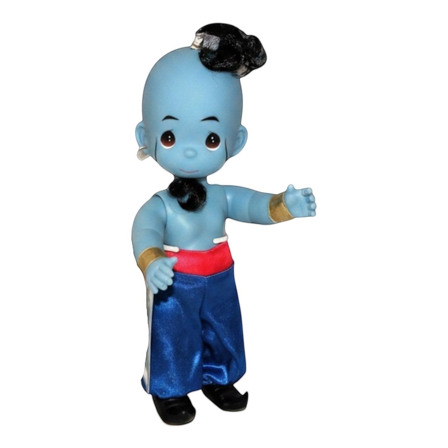 The Doll Maker 12-inch Genie doll from Aladdin featuring blue skin, black hair, and satin red and blue trousers.