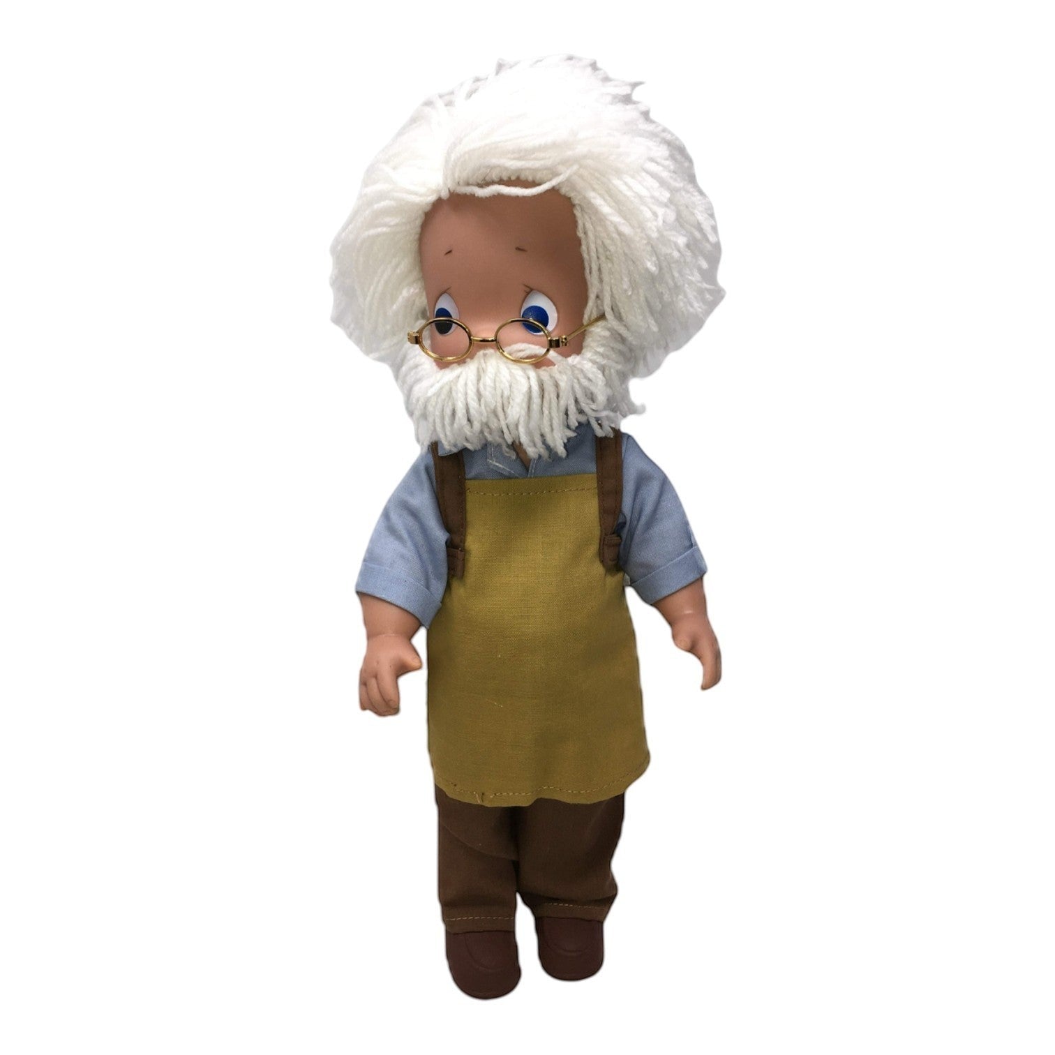 The Doll Maker 12-inch Geppetto collectible doll with white yarn hair, glasses, blue shirt, and brown apron.