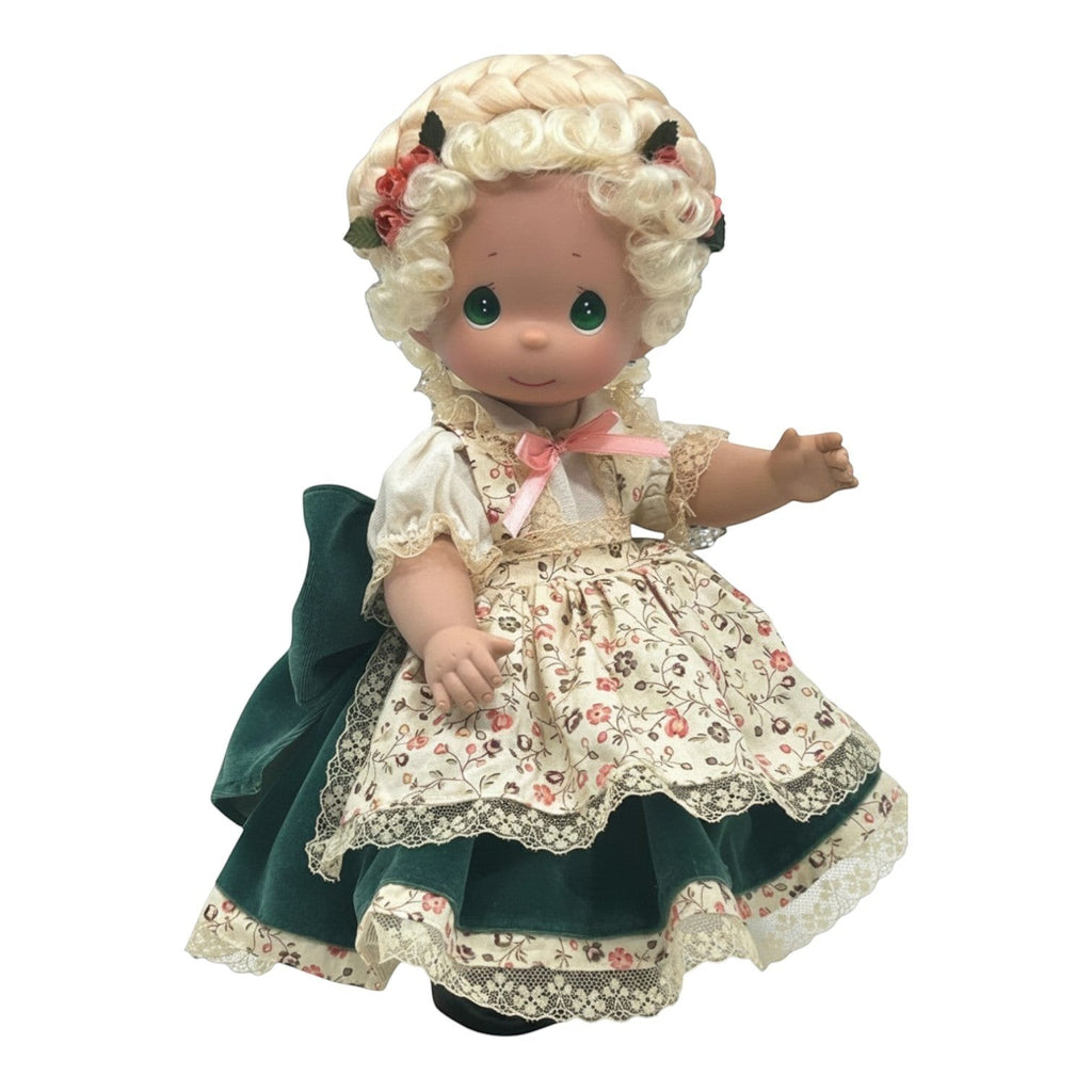 The Doll Maker 12-inch German girl doll in traditional floral dress with green velvet skirt and blonde hair.