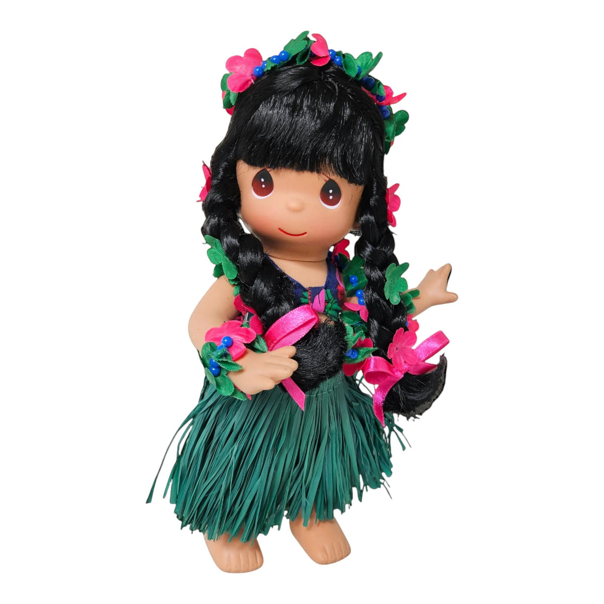 The Doll Maker 9-inch Hawaii Pualani doll with black braided hair, floral lei, and a green grass hula skirt.