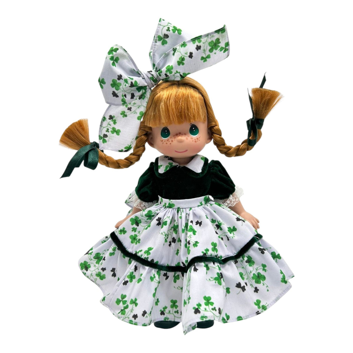 The Doll Maker 12-inch Ireland collectible doll with red hair, freckles, and a green and white shamrock dress.
