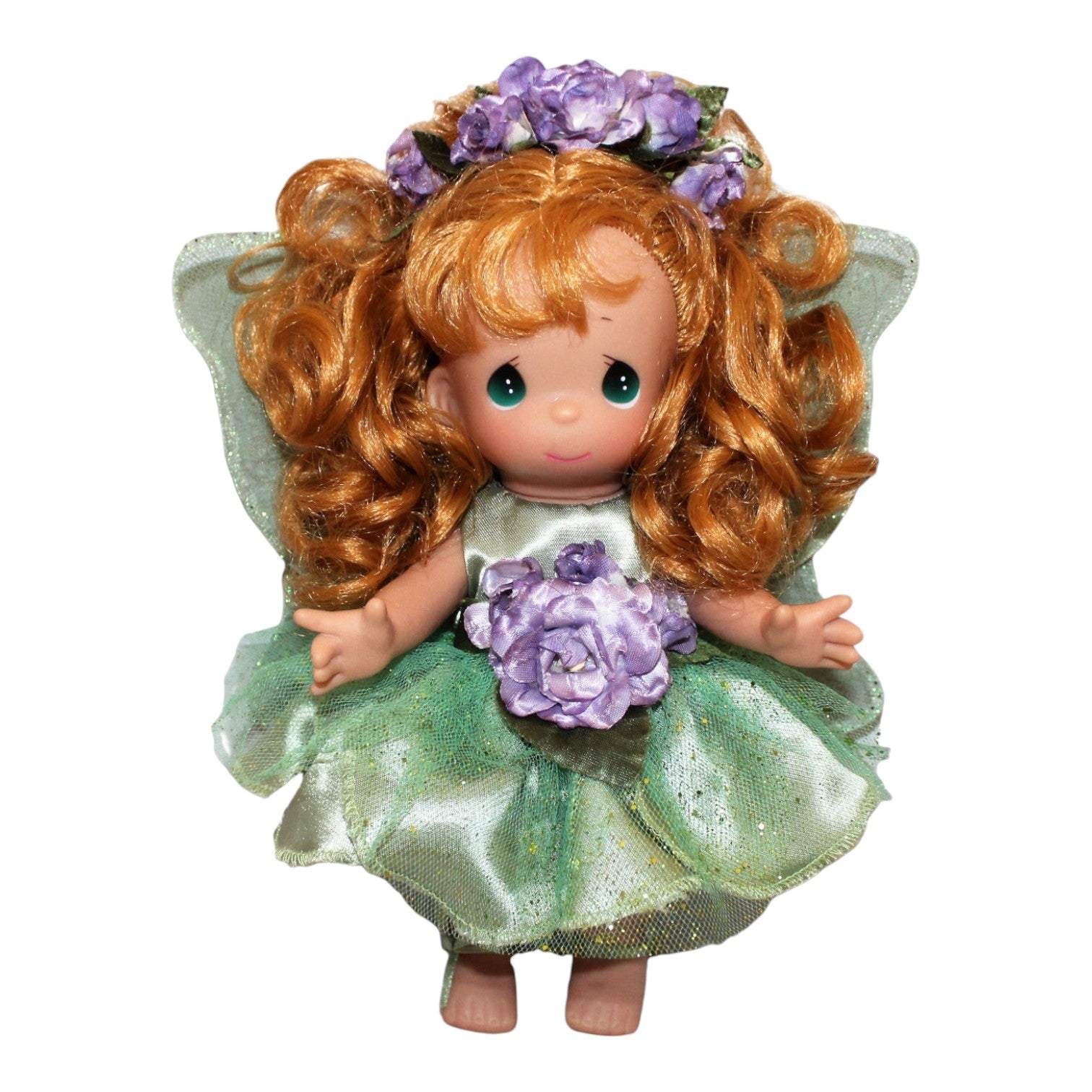 The Doll Maker Woodland Fairy Ivy 9-inch vinyl doll with curly red hair, green dress, and purple flower accents.