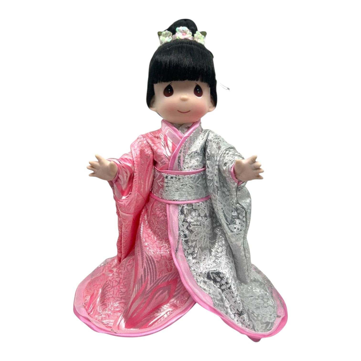The Doll Maker 12-inch Japan doll in a pink and silver kimono with traditional hairstyle and floral hair accessory.