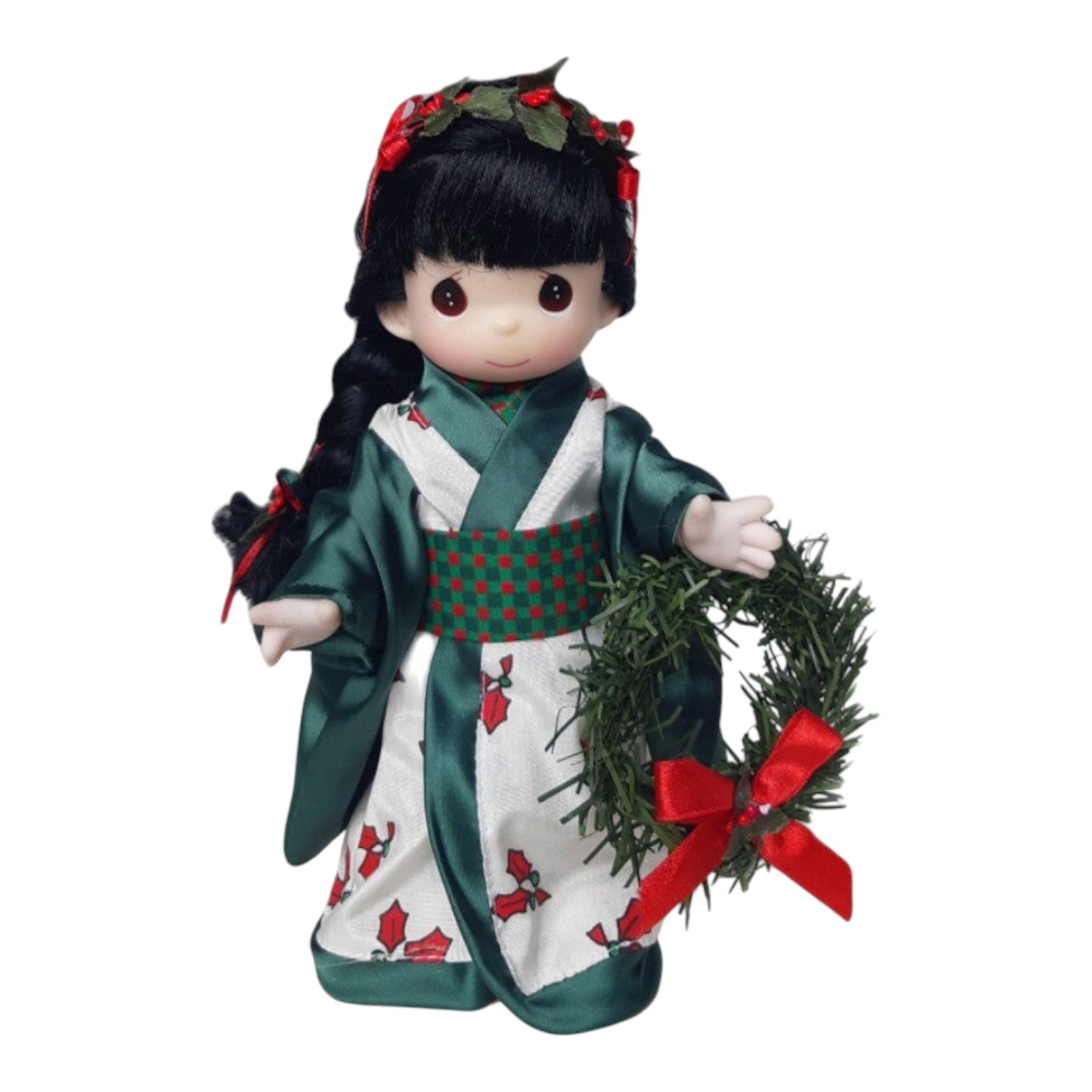 The Doll Maker 9-inch Japanese Chisa doll wearing a festive green and white kimono with a holly print and wreath.