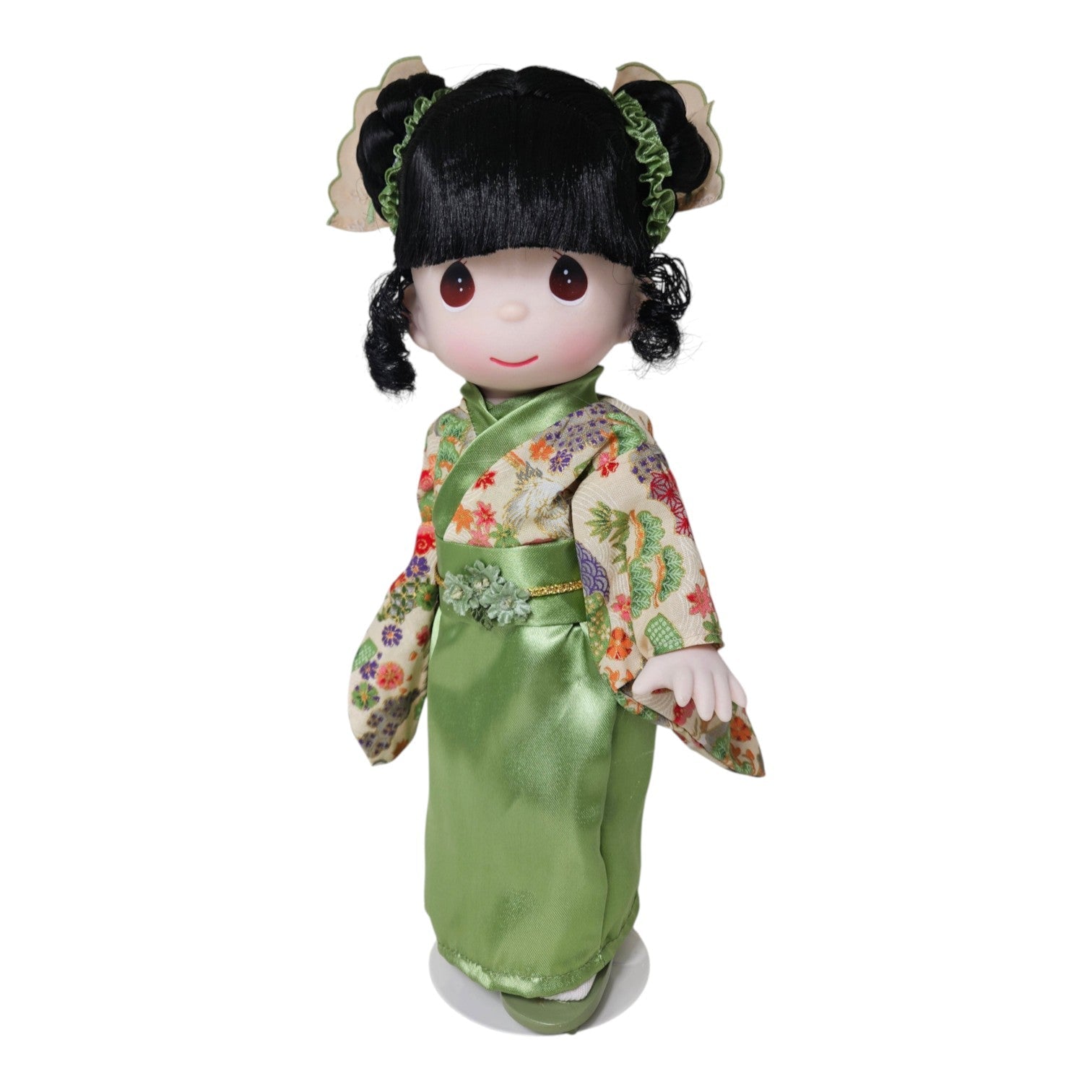 The Doll Maker Japanese Girl's Day doll wearing an elegant green floral kimono with fun hair styling.