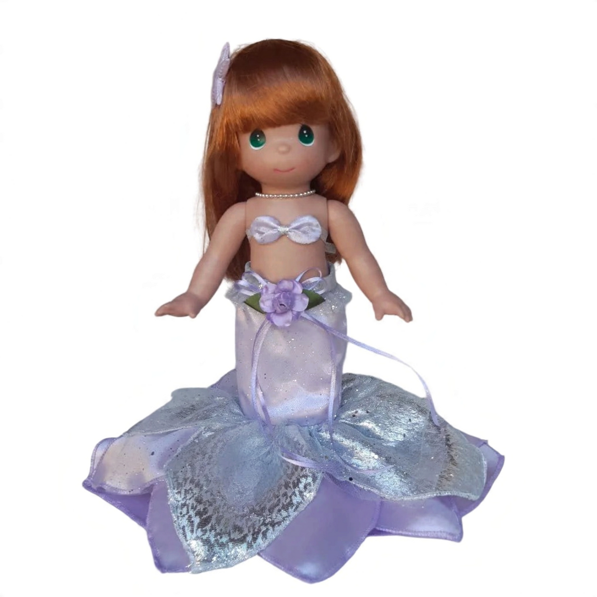 The Doll Maker 12-inch Ariel mermaid doll with red hair, lavender and silver shimmering fins, and floral detail.