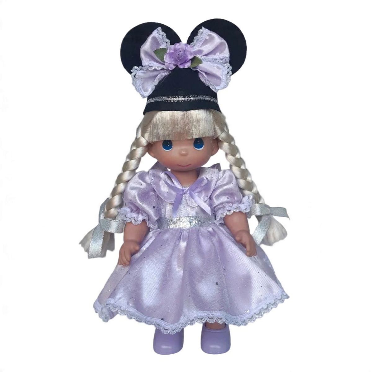 The Doll Maker 12-inch blonde Mouseketeer doll wearing a lavender satin dress and a black hat with mouse ears.
