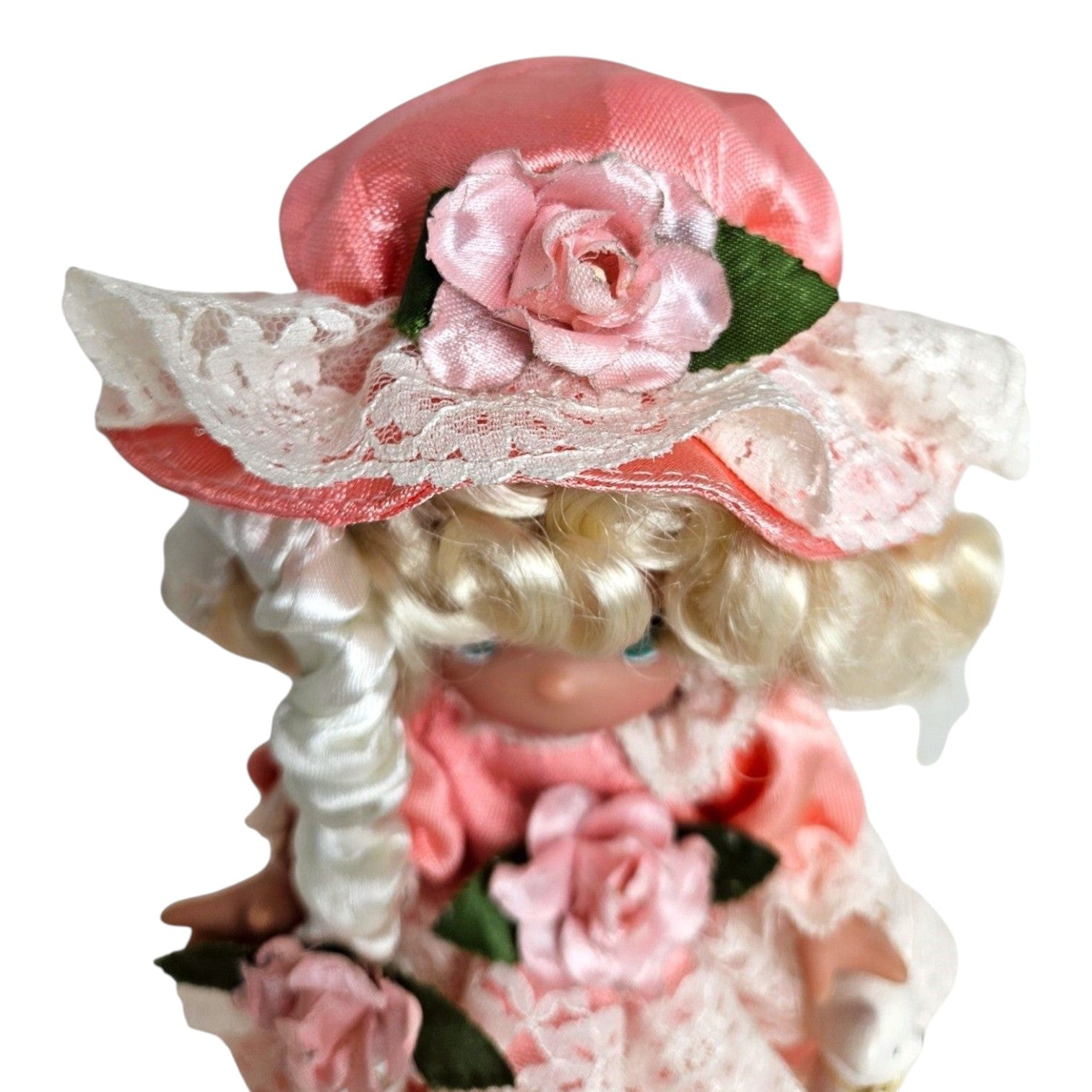 The Doll Maker 7-inch Little Bo Peep vinyl doll with blonde hair, wearing a pink dress and floral lace bonnet.