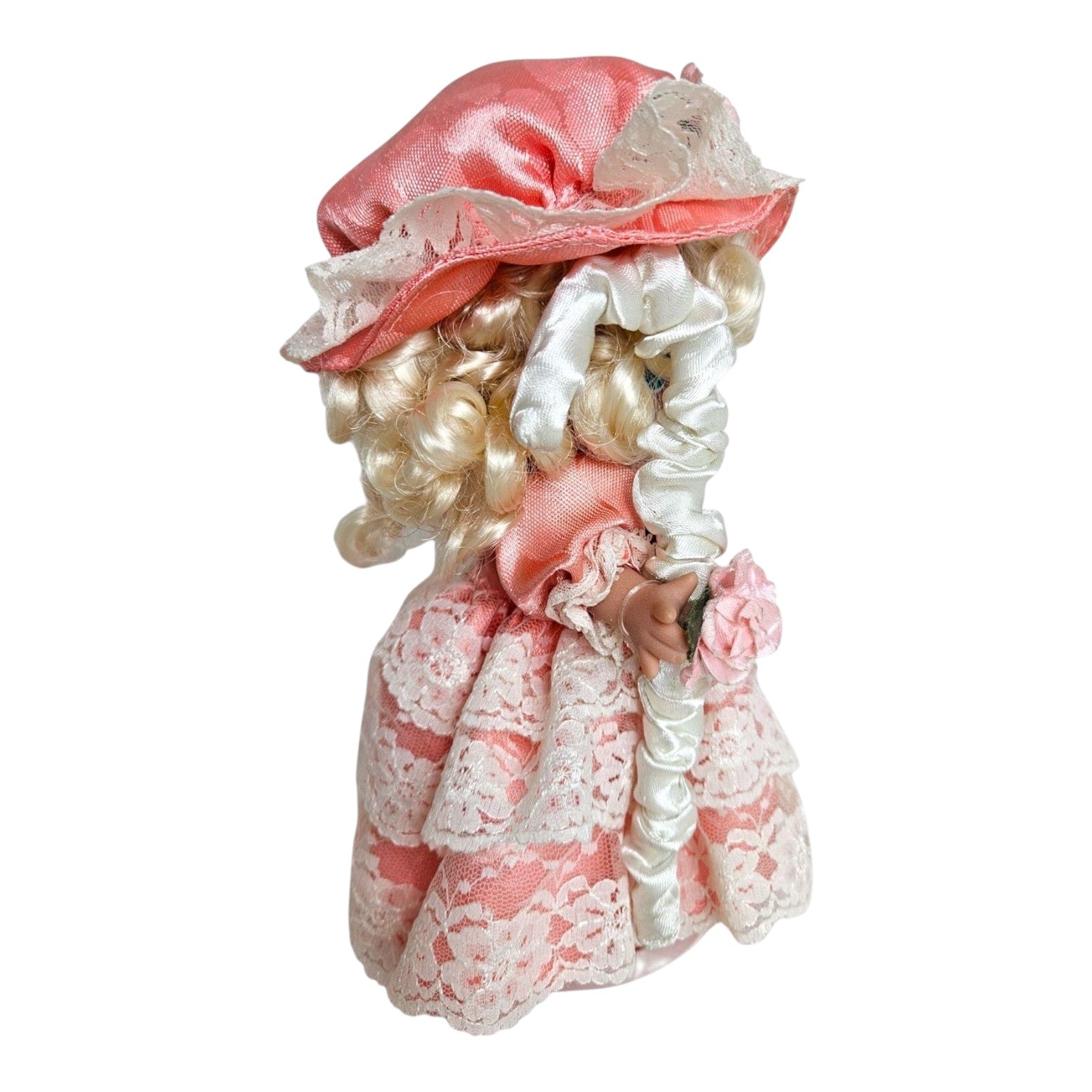 The Doll Maker 7-inch Little Bo Peep vinyl doll in a pink satin dress with lace trim and matching bonnet