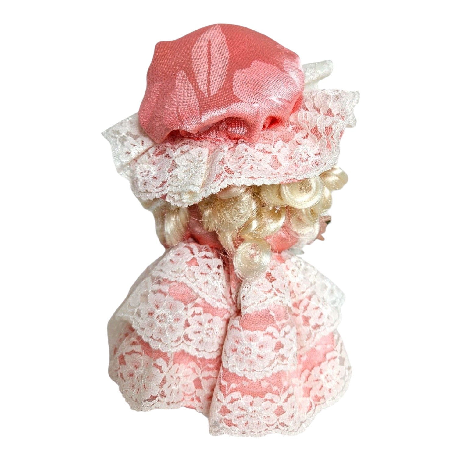 The Doll Maker 7-inch Little Bo Peep vinyl doll featuring blonde curls, a pink satin bonnet, and lace-trimmed dress.