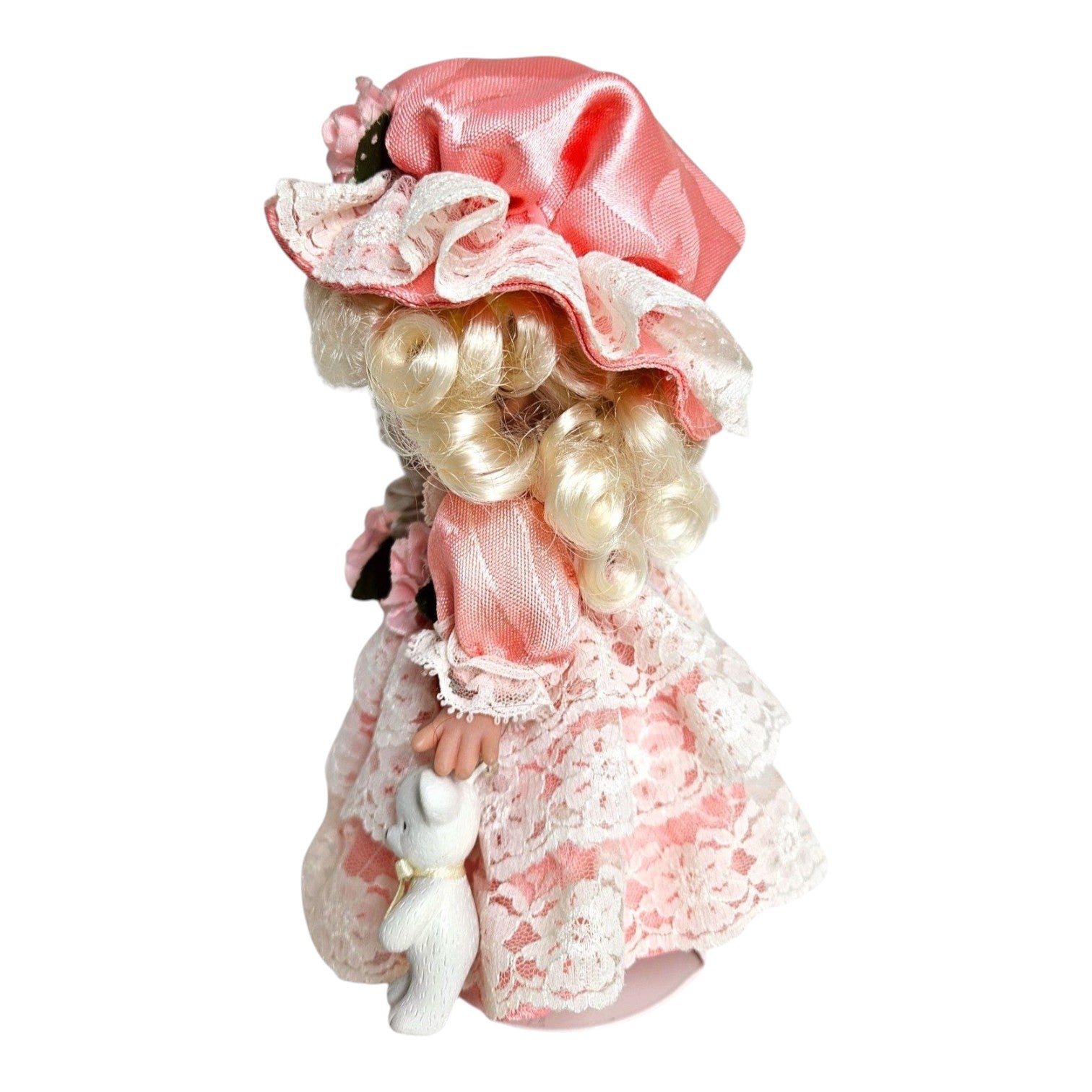 The Doll Maker 7-inch Little Bo Peep vinyl doll in a pink satin and lace dress with a matching bonnet and staff