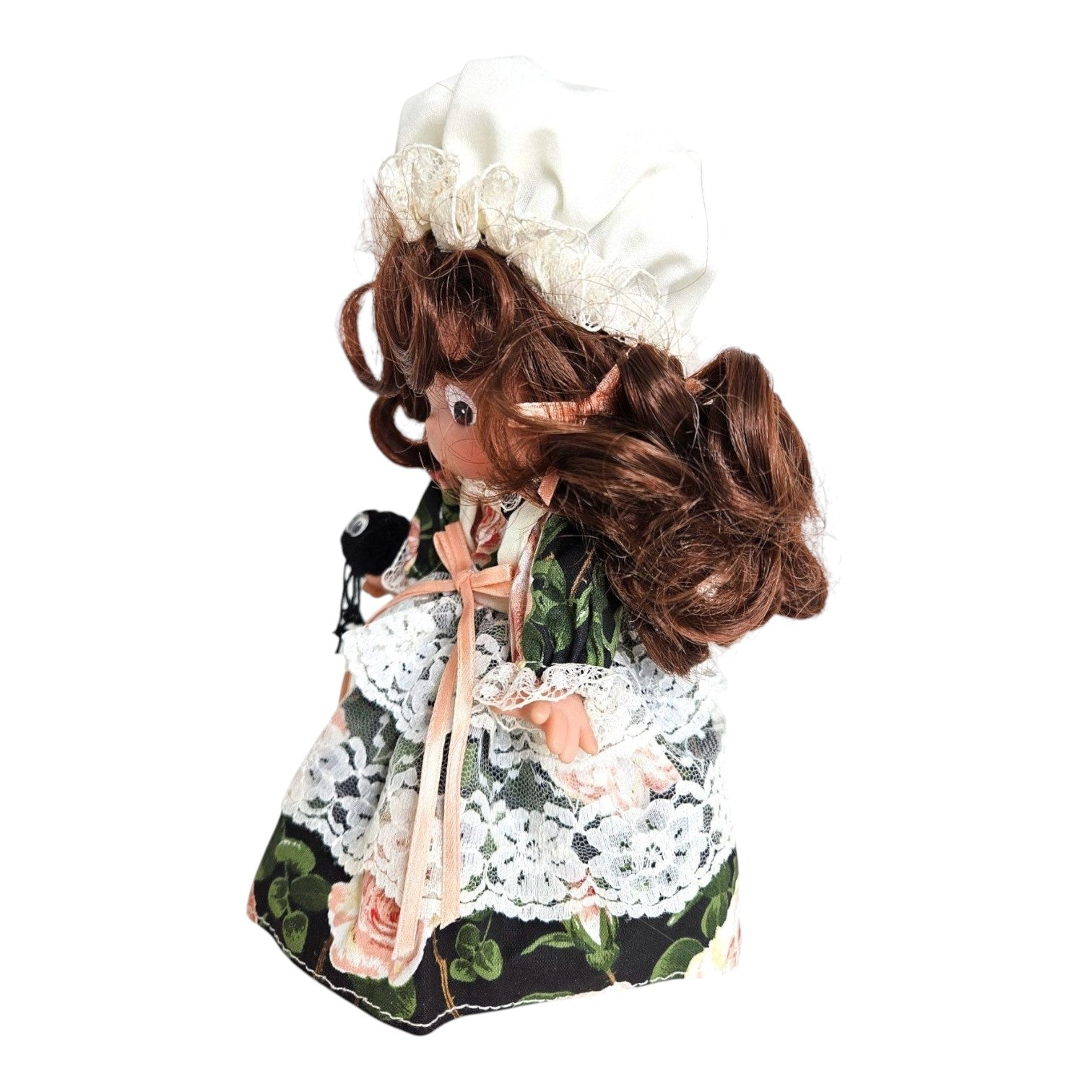 The Doll Maker Little Miss Muffet 7-inch vinyl doll wearing a floral dress with lace and a white bonnet holding a spider