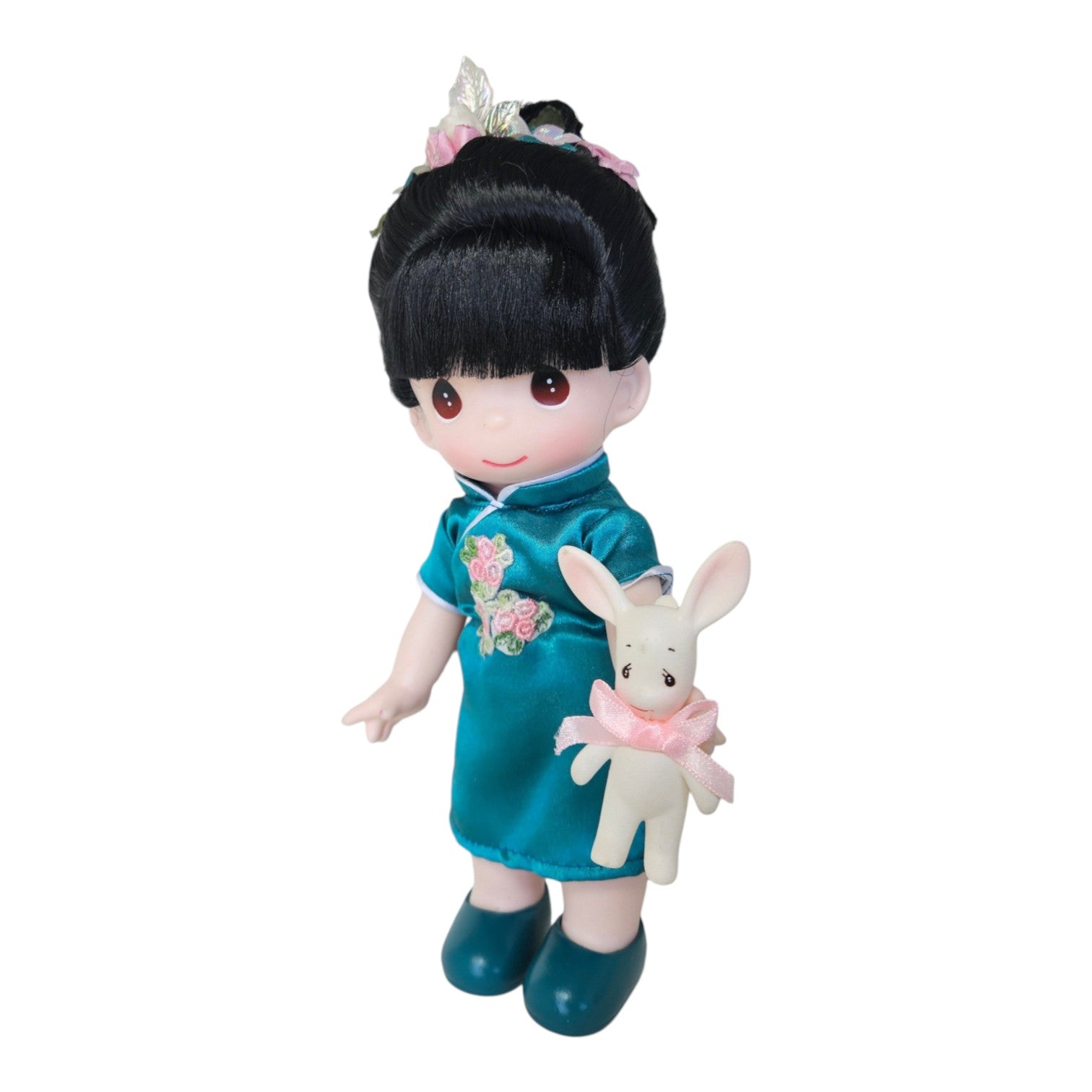 The Doll Maker 9-inch Lunar New Year doll in a teal satin cheongsam dress holding a small white rabbit with pink bow.