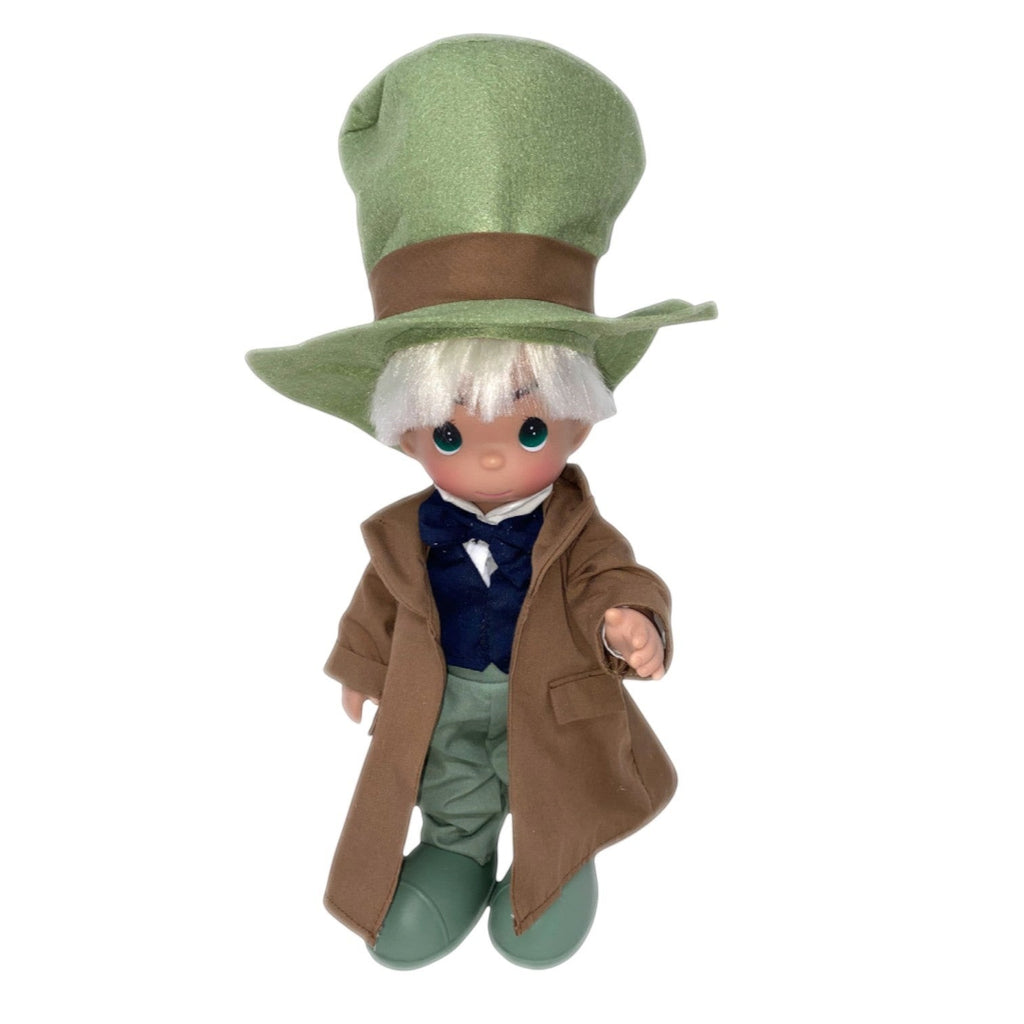 The Doll Maker 12-inch Mad Hatter doll from Alice in Wonderland wearing a green top hat, brown coat, and blue vest.