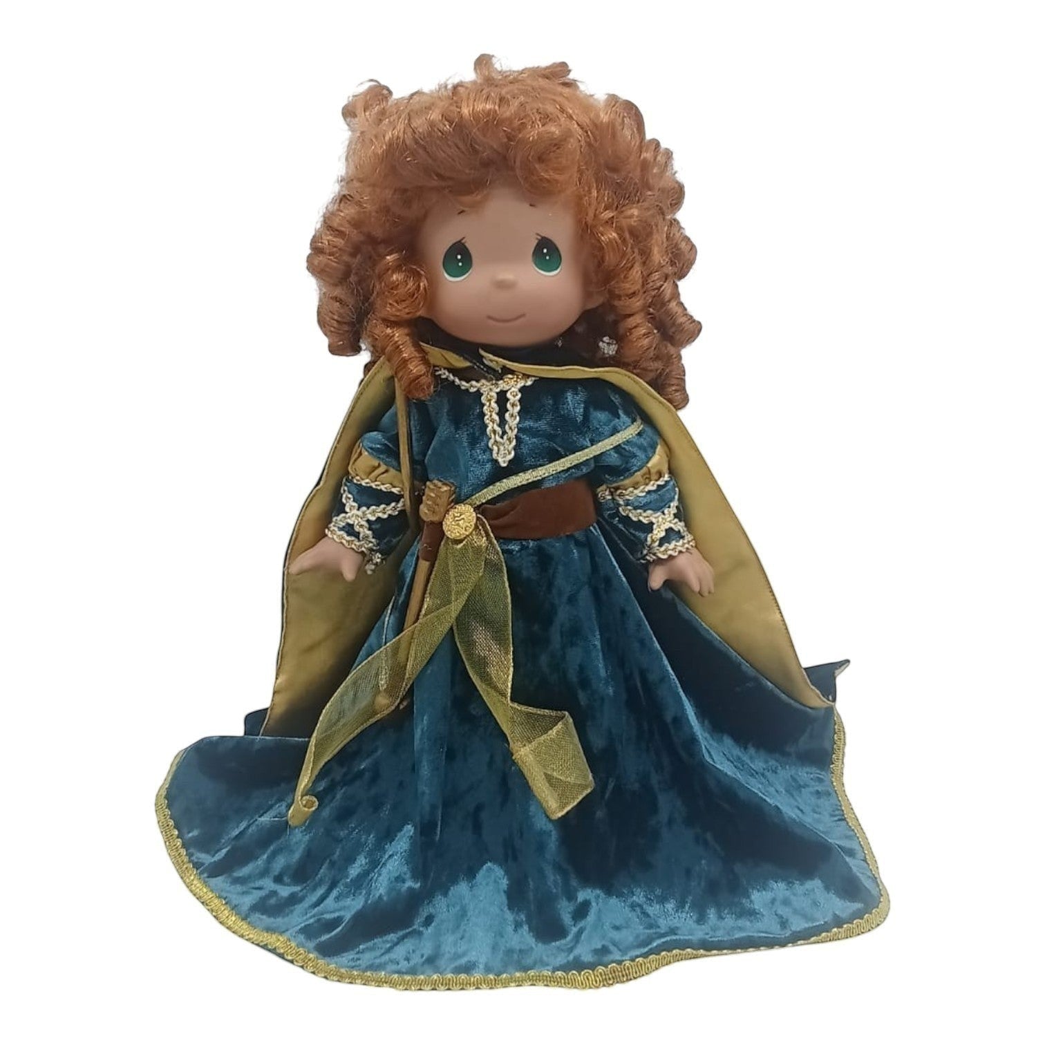 The Doll Maker 12-inch Merida Brave warrior doll with curly red hair wearing a teal velvet dress and gold cape.