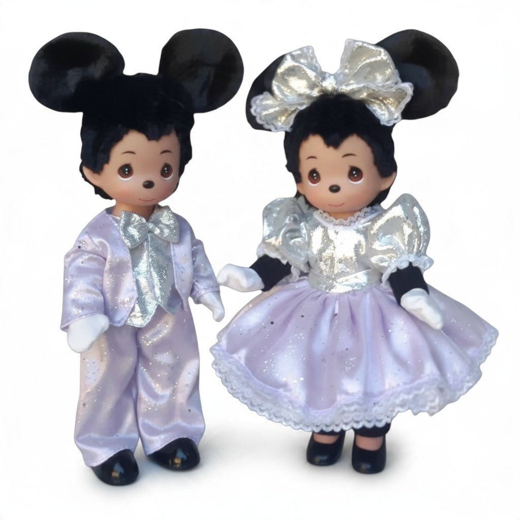 The Doll Maker 12-inch Mickey and Minnie Mouse collector dolls in lavender and silver outfits for 100th anniversary.