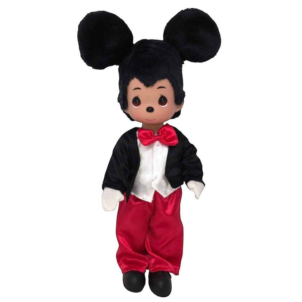 The Doll Maker 12-inch Mickey Mouse vinyl collectible doll wearing a black tuxedo jacket, red trousers, and bow tie.