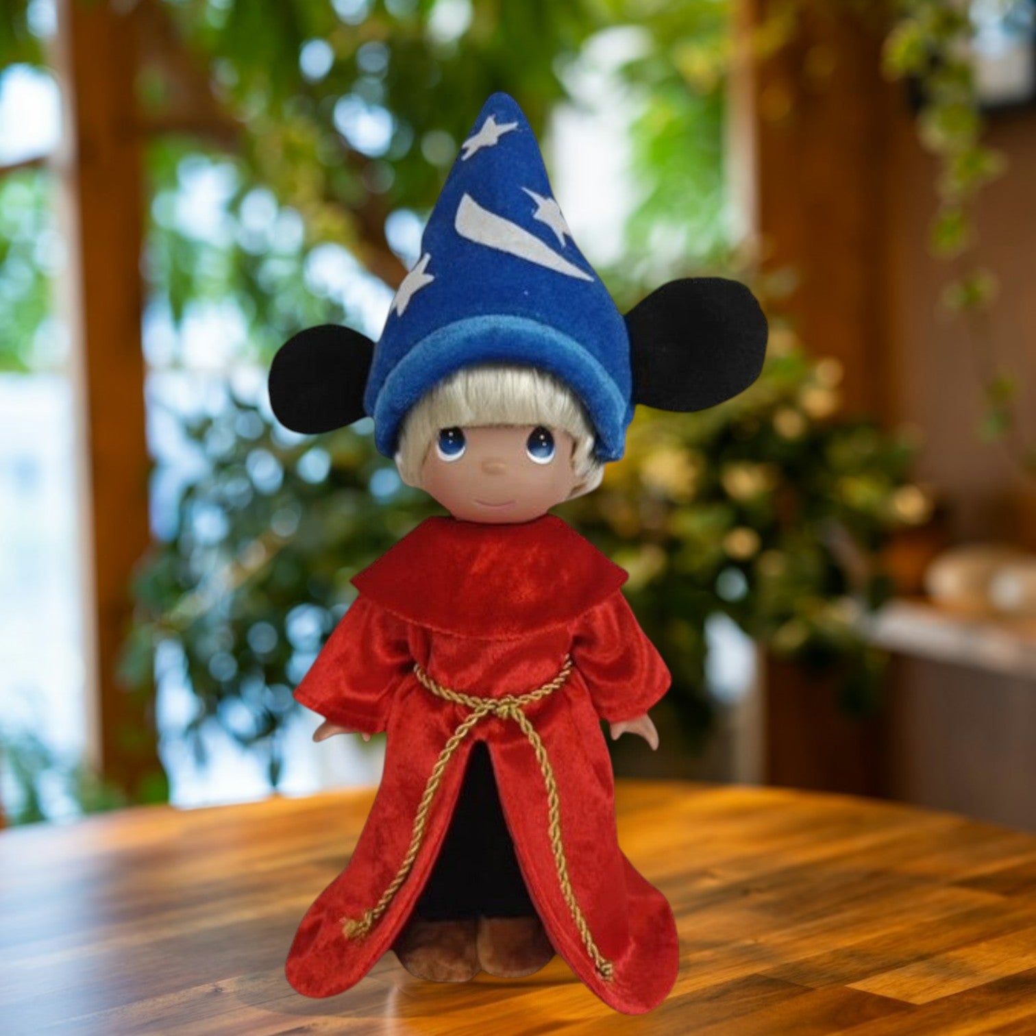 The Doll Maker 12-inch Mickey Sorcerer doll wearing a blue star-patterned wizard hat and a red velvet robe.
