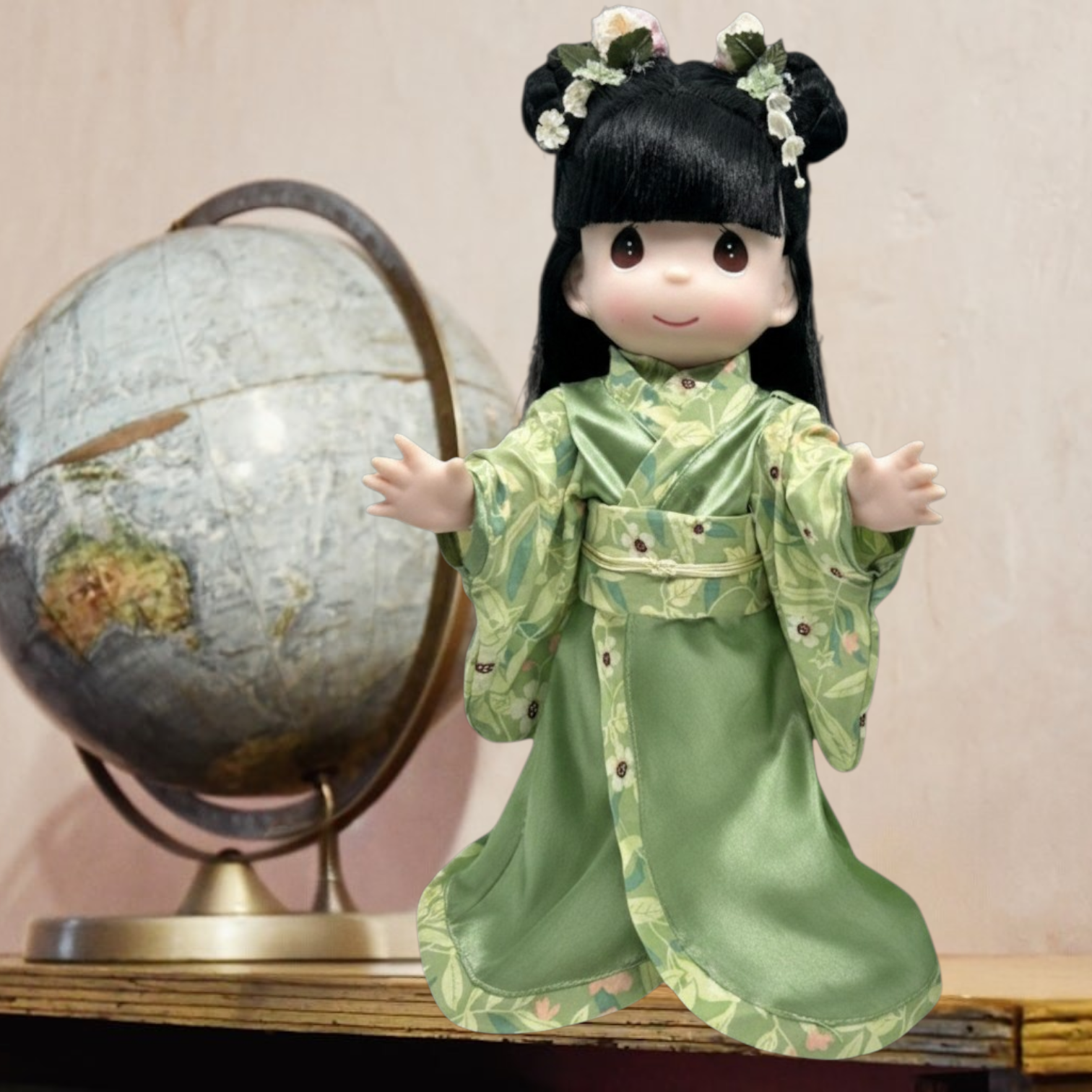 The Doll Maker 12-inch Midori doll in a green floral kimono with black hair and a matching satin parasol