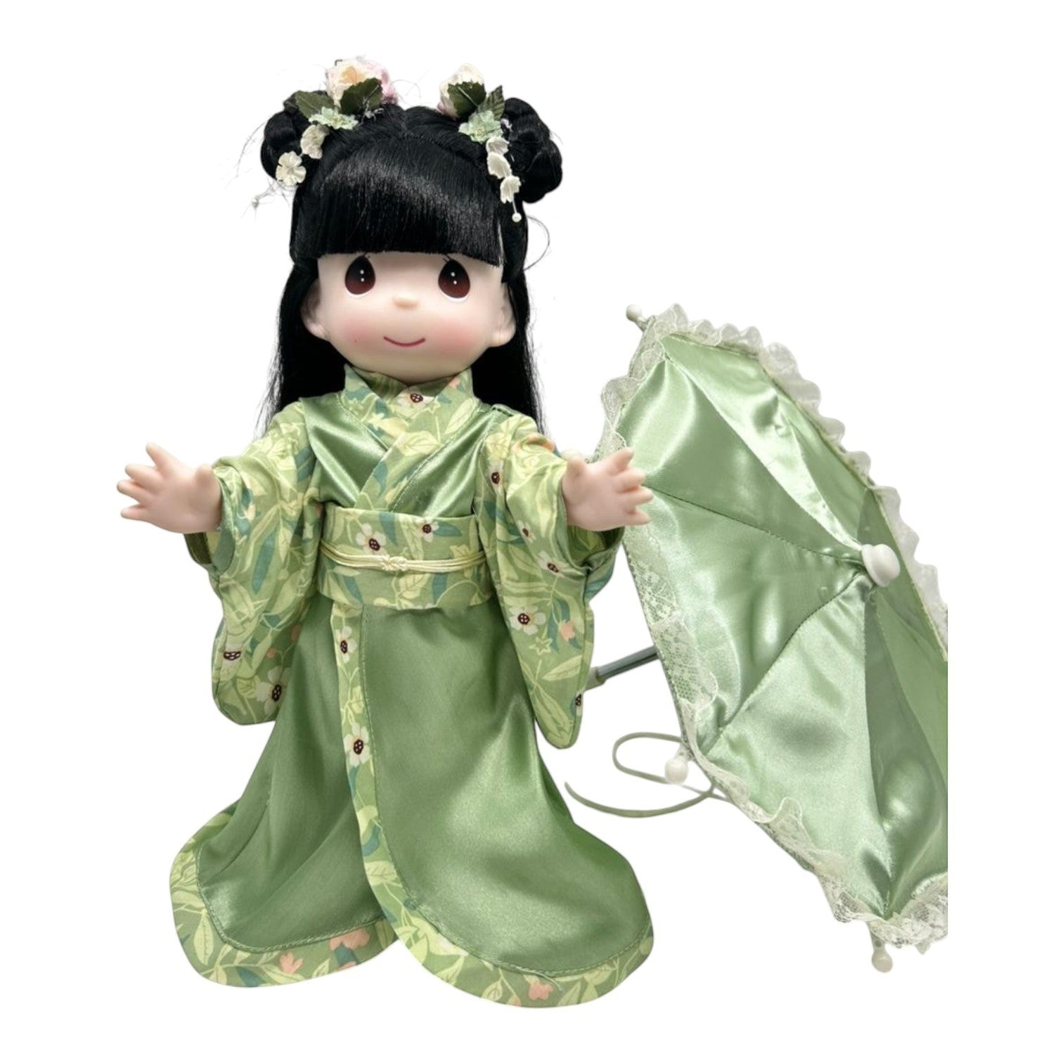 The Doll Maker 12-inch Midori doll wearing a green floral kimono with a matching satin parasol and hair accessories.