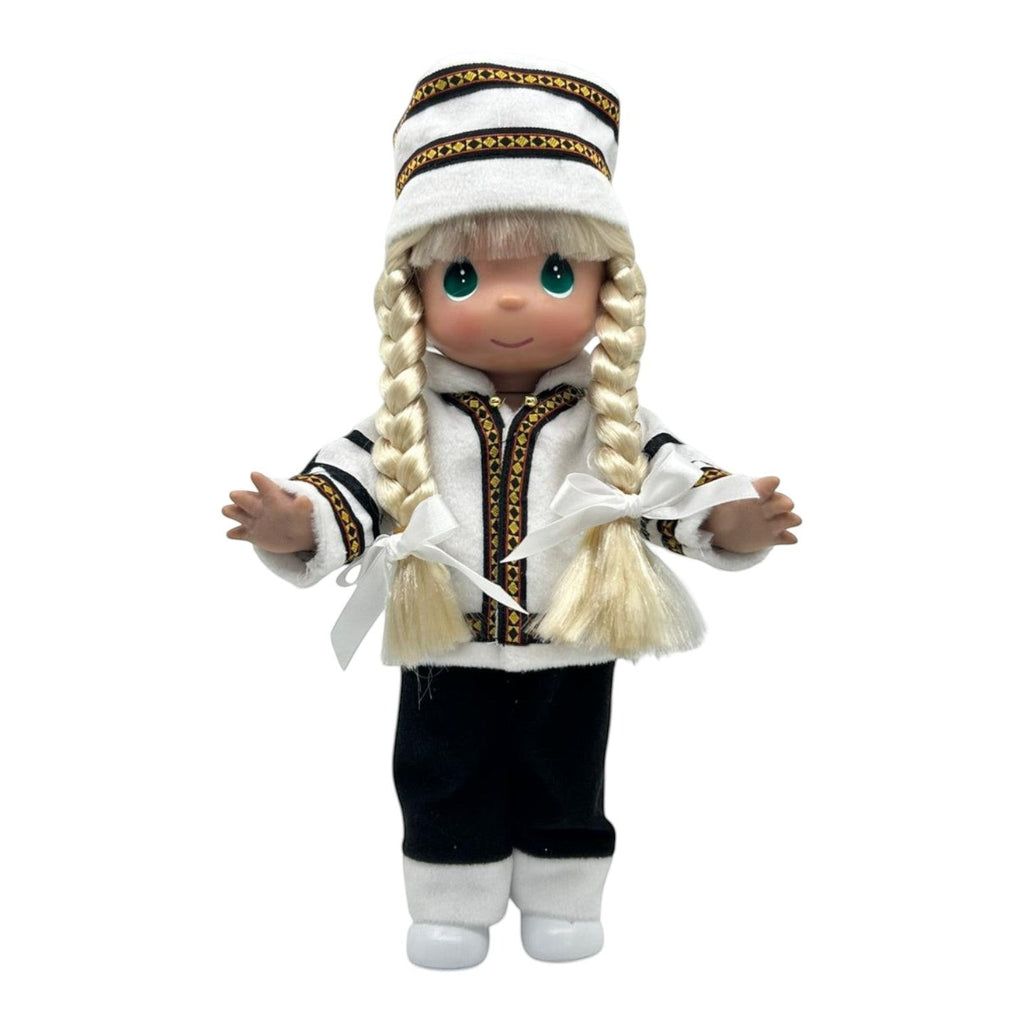 The Doll Maker 12-inch Norwegian doll with blonde braided hair wearing a traditional white and black Scandinavian costume