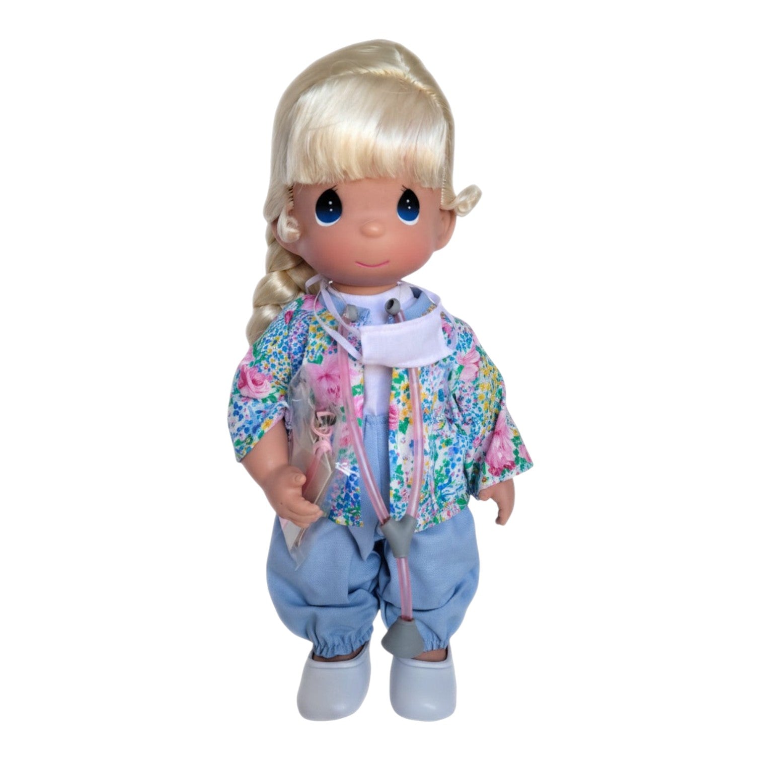 The Doll Maker Caring for You Nurse 12-inch vinyl doll with blonde hair, floral jacket, and blue scrubs with stethoscope