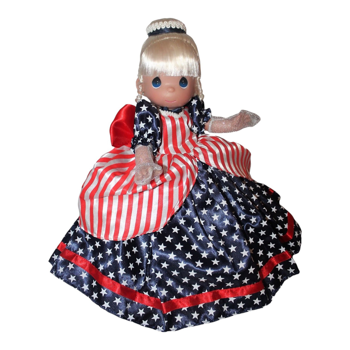 The Doll Maker Patriotic Cinderella 12-inch doll wearing a red, white, and blue star and stripe gown.