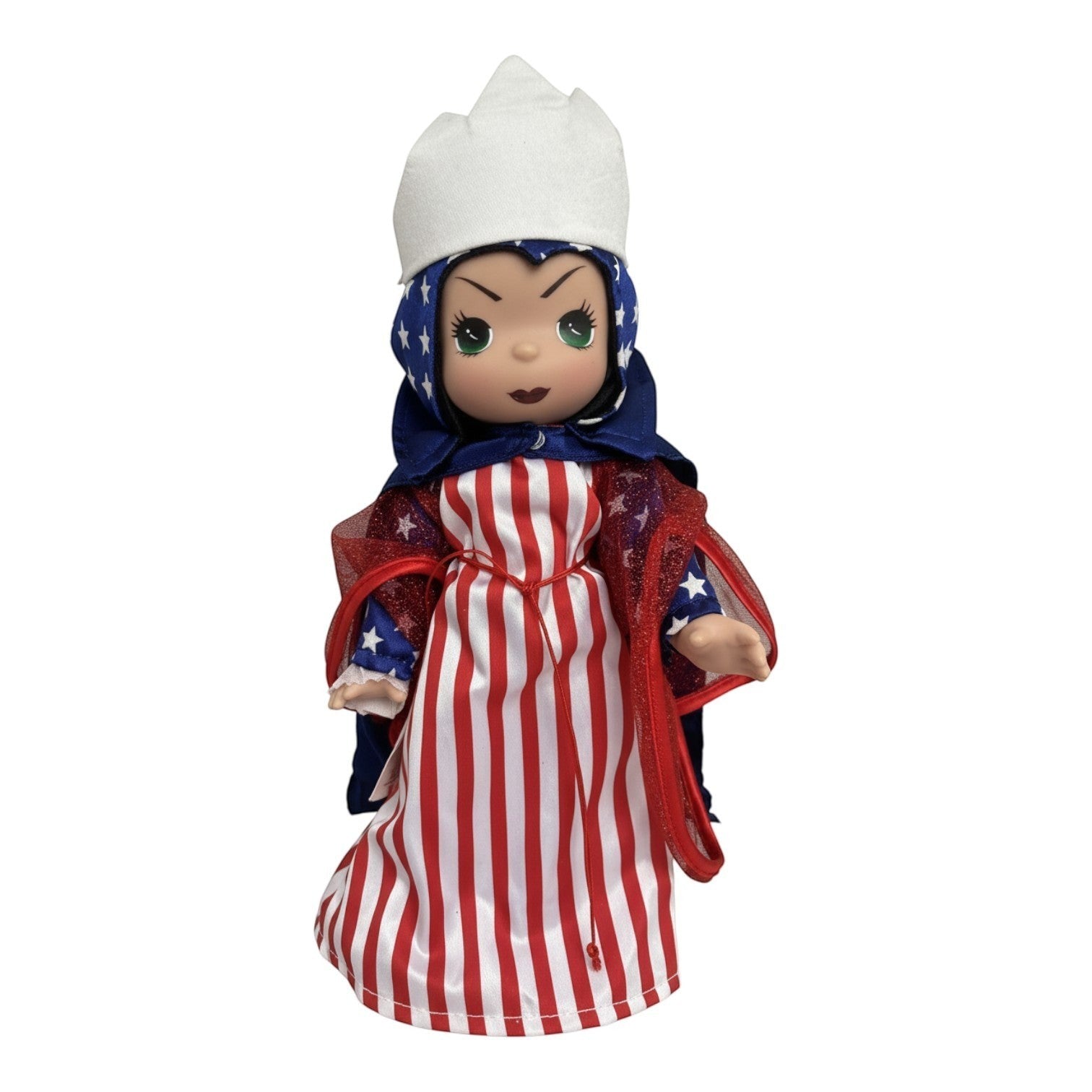 The Doll Maker 12-inch Patriotic Evil Queen doll wearing a red and white striped dress and star-patterned cape.