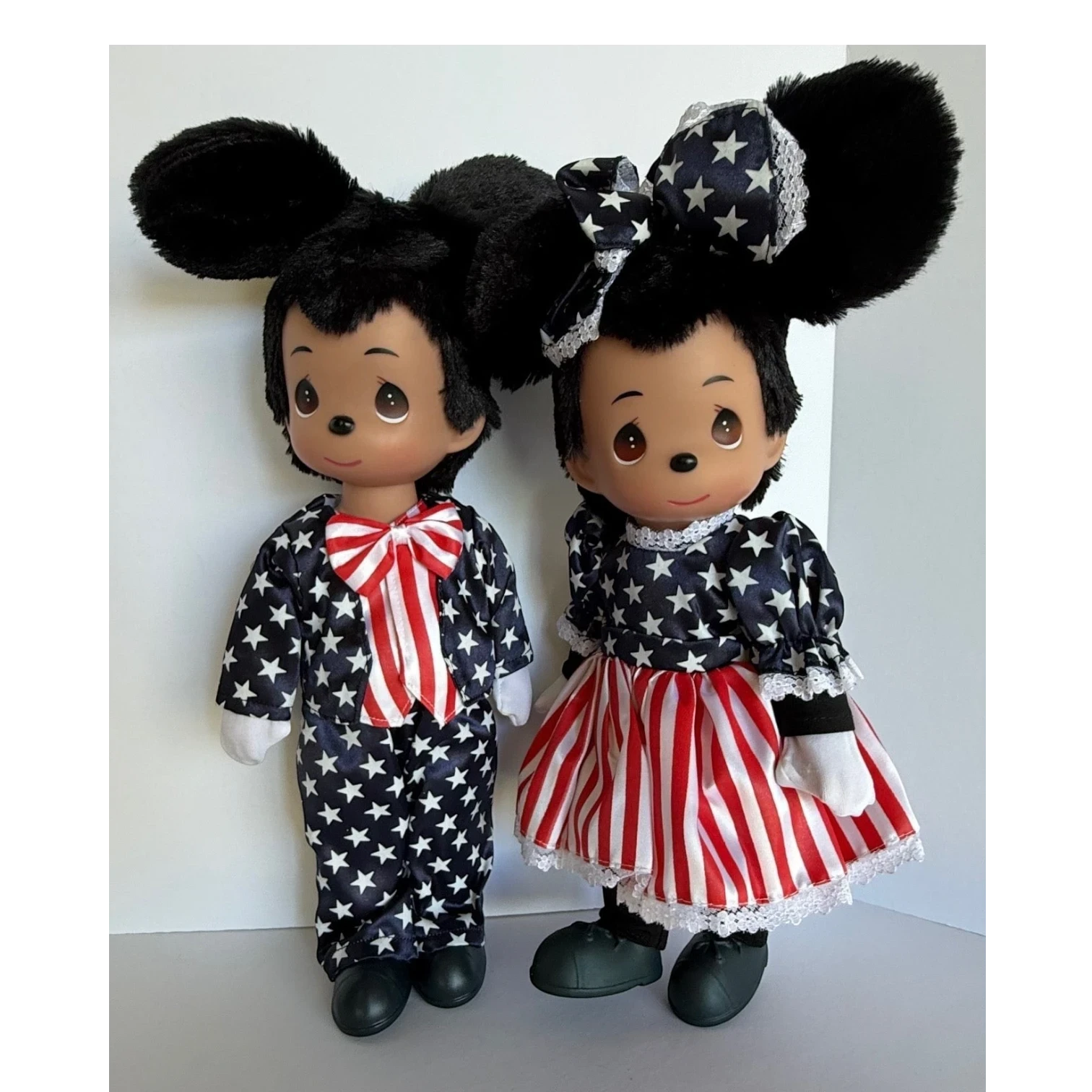 The Doll Maker 12-inch Mickey and Minnie dolls in patriotic red, white, and blue star and stripe outfits.