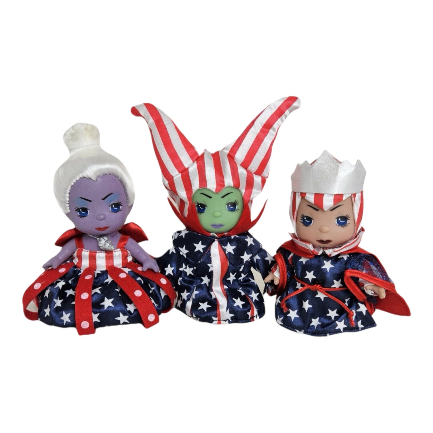 The Doll Maker Patriotic Mini Villains set featuring three 5-inch dolls in red, white, and blue star-spangled outfits.