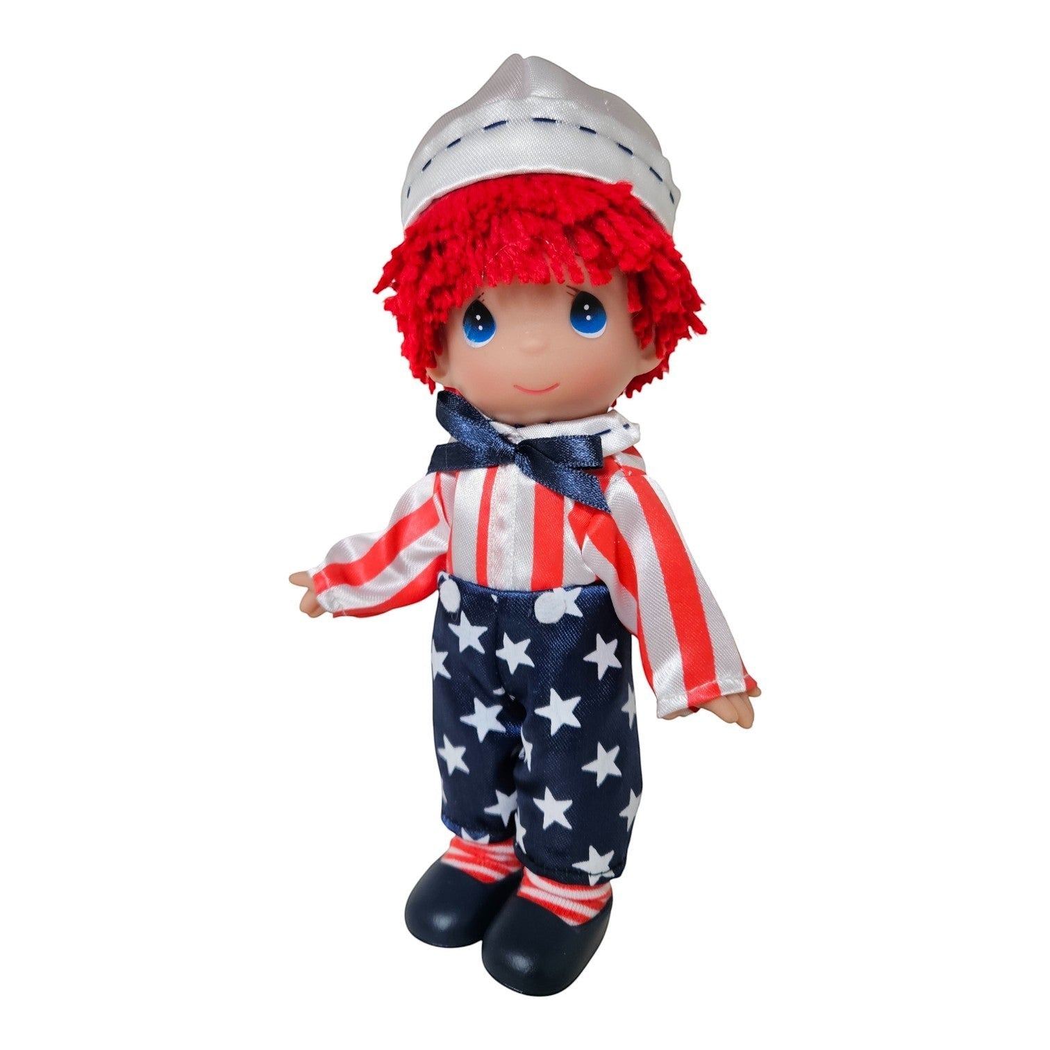 The Doll Maker 7-inch Patriotic Raggedy Andy vinyl doll wearing a star-spangled outfit and a white sailor hat.