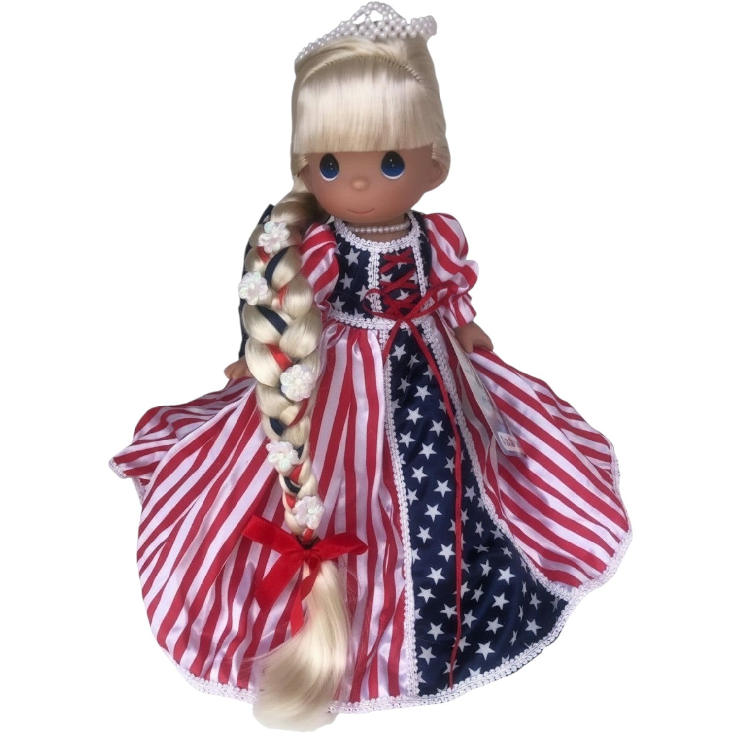 The Doll Maker 12-inch Patriotic Rapunzel doll with long blonde braided hair and a red, white, and blue star dress.