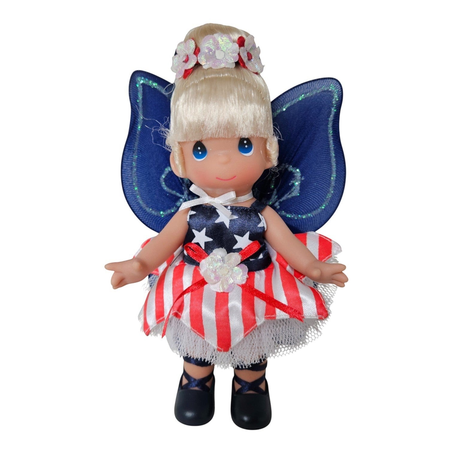 The Doll Maker Patriotic Tinker Bell 7-inch vinyl doll wearing a star-spangled dress with blue wings and floral crown.