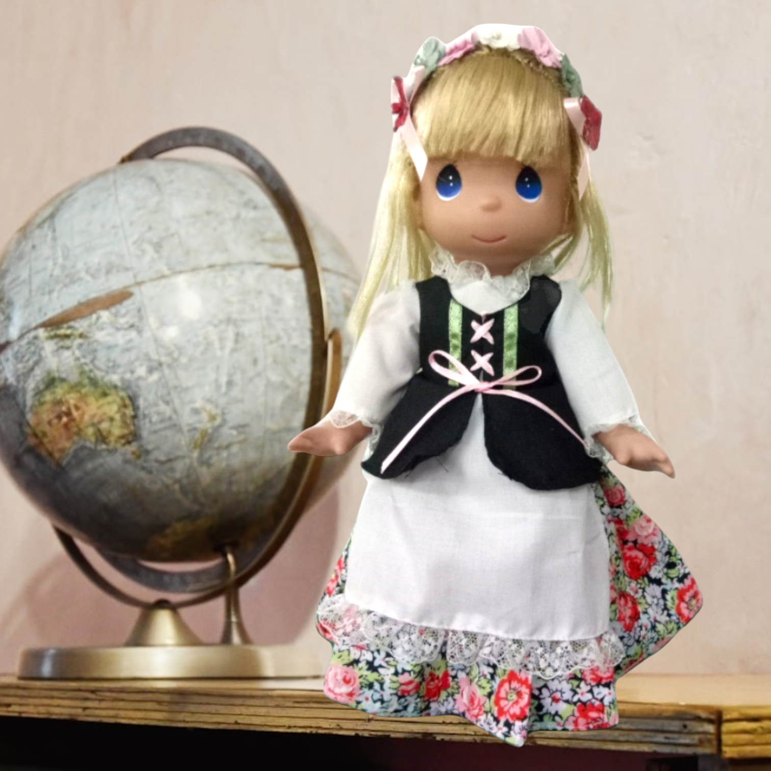 The Doll Maker 12-inch Polish costume doll with blonde hair, floral headpiece, and traditional folk dress.