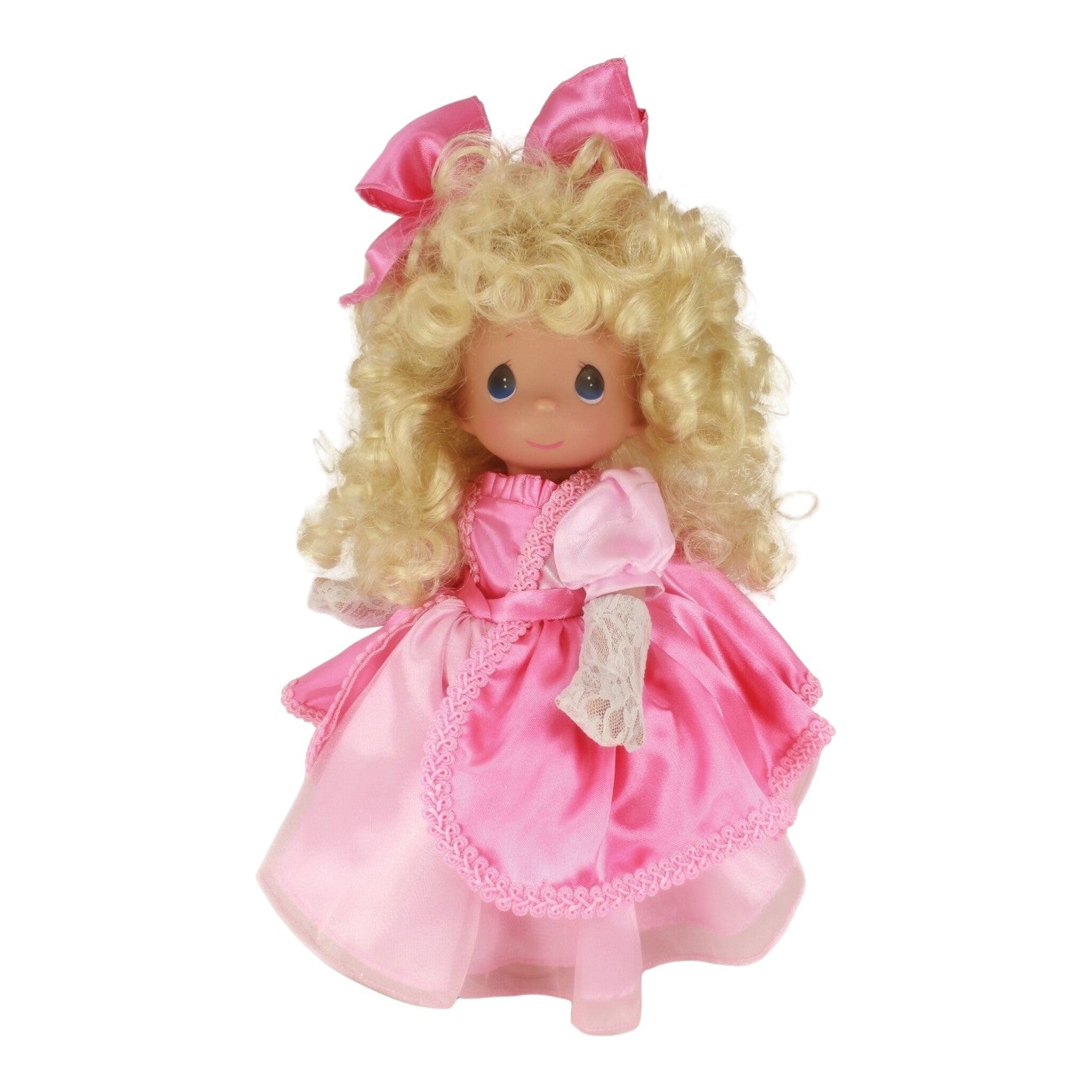 The Doll Maker Precious Moments vinyl doll with blonde curly hair wearing a pink satin dress and matching bow