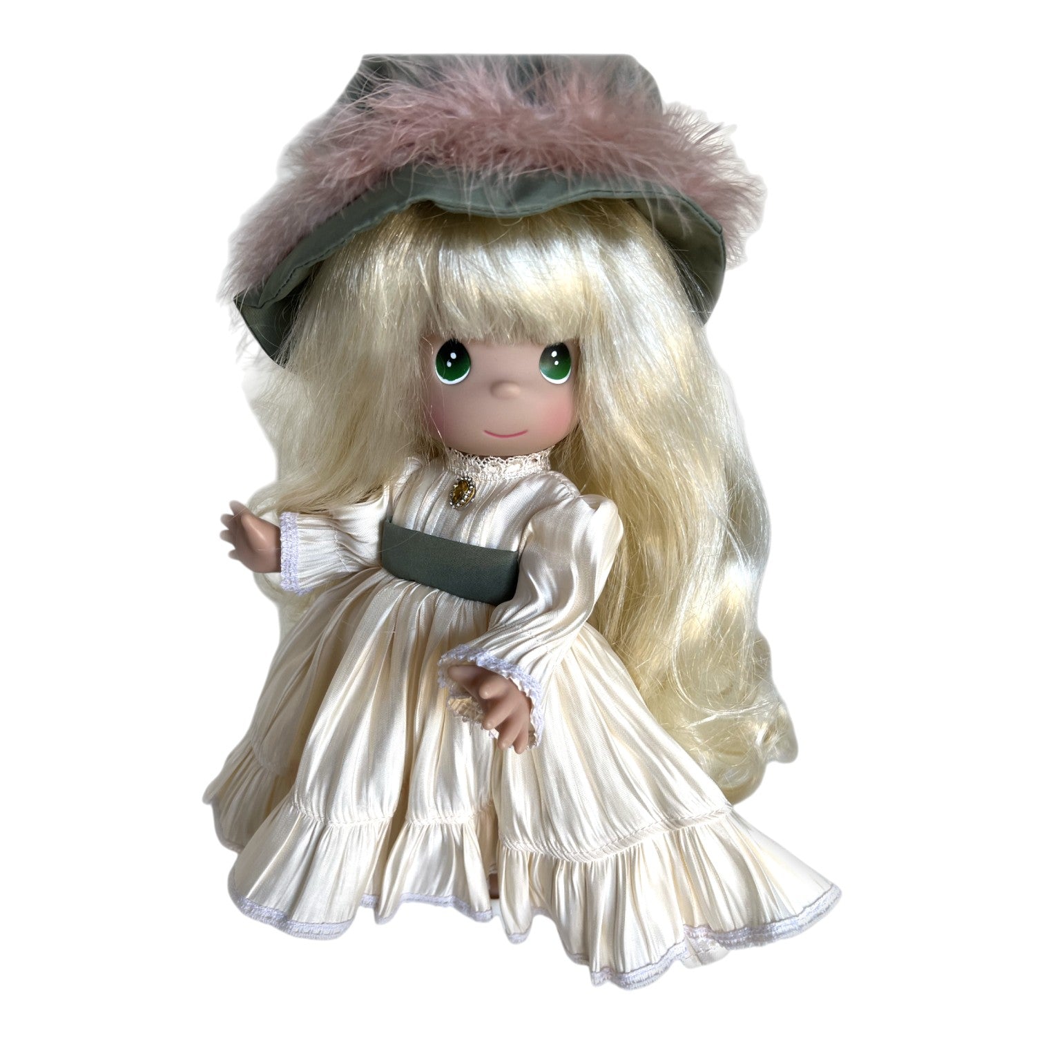 The Doll Maker Precious Moments 12-inch vinyl doll with long blonde hair, wearing a cream dress and green feathered hat.
