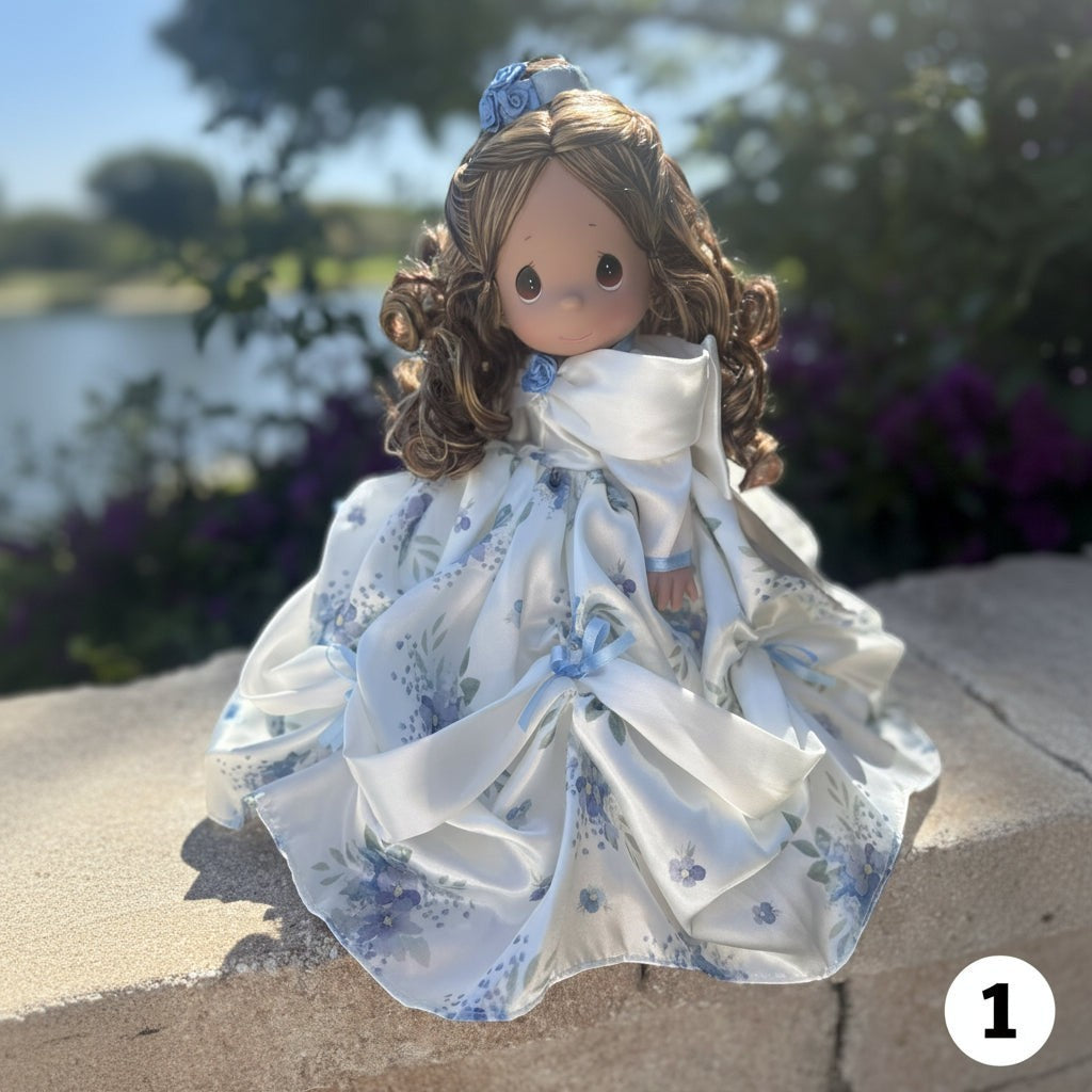 The Doll Maker 12-inch Mother's Day princess doll with brown curls, wearing a white satin gown with blue floral print.