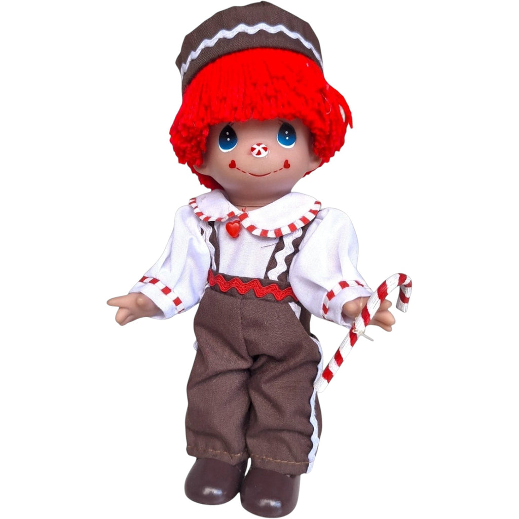 The Doll Maker 7-inch Raggedy Andy gingerbread doll with red yarn hair, brown outfit, and candy cane accessory.