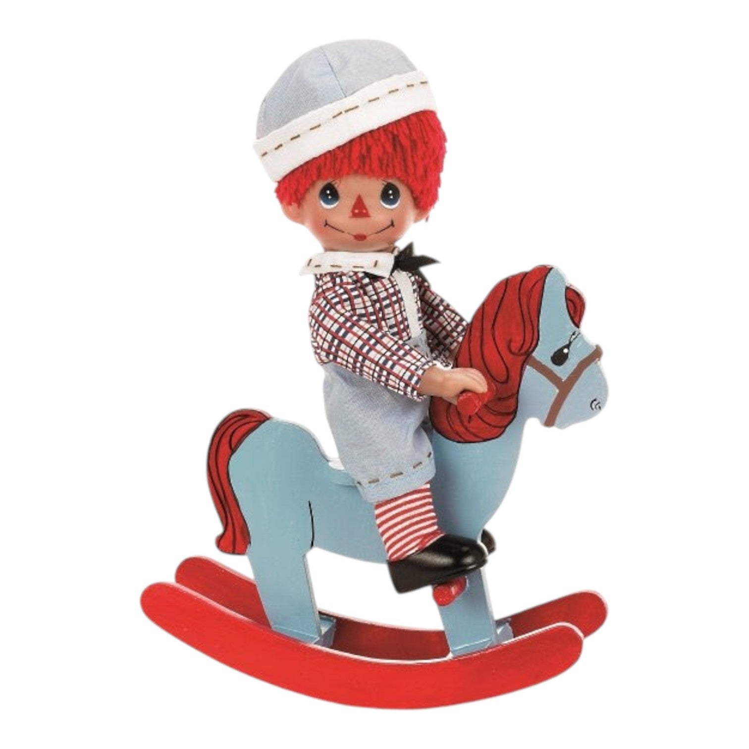 The Doll Maker 9-inch Rockin' Raggedy Andy vinyl doll wearing a plaid shirt and hat, riding a blue rocking horse.