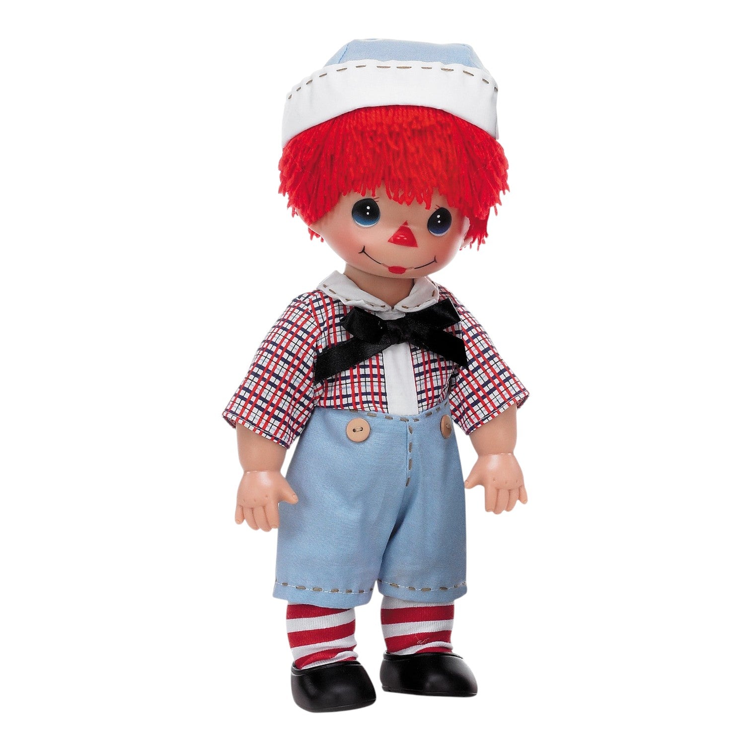 The Doll Maker 12-inch Raggedy Andy vinyl doll with red yarn hair, plaid shirt, blue shorts, and striped socks.
