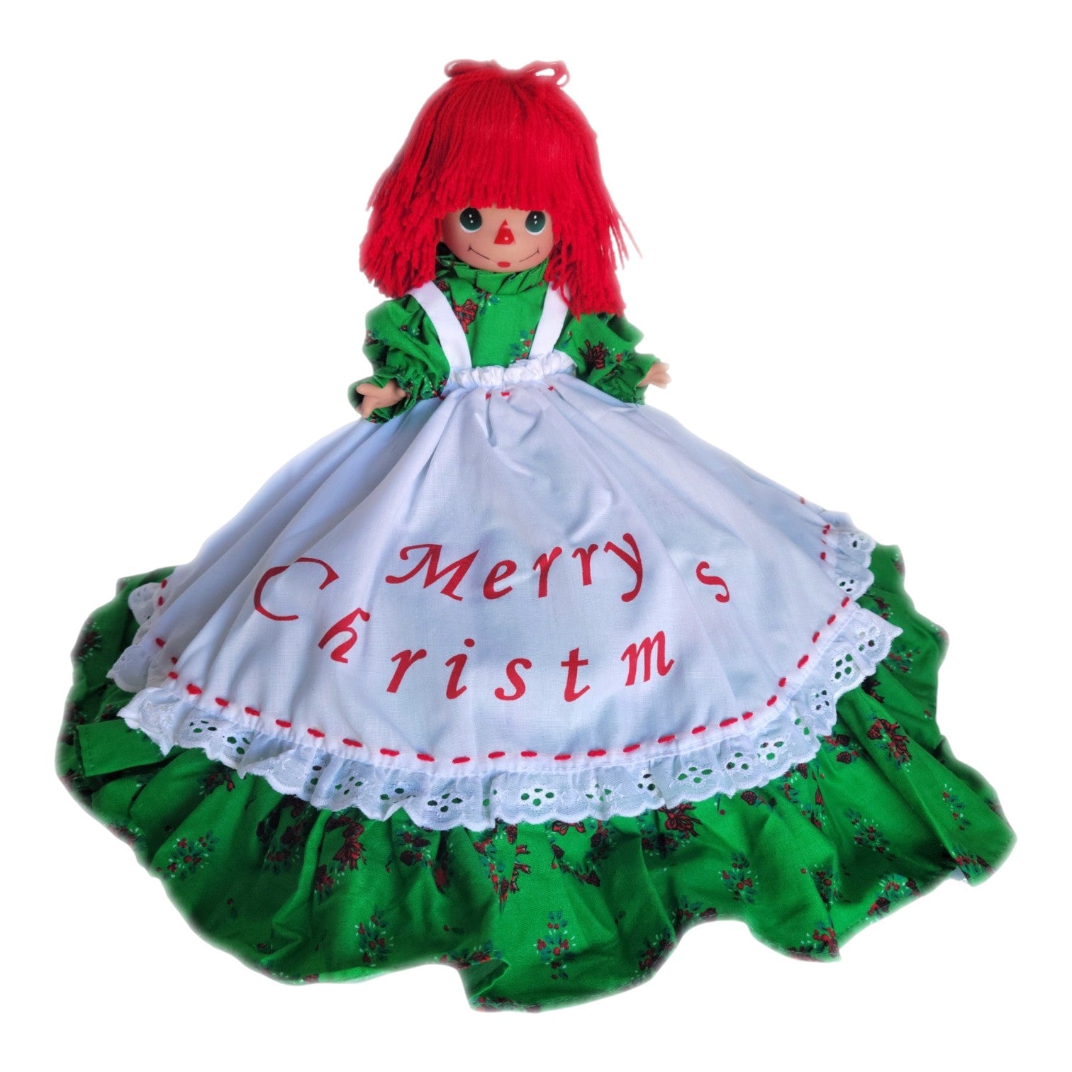 The Doll Maker 12-inch Raggedy Ann Christmas tree topper with red hair and a green dress featuring Merry Christmas apron
