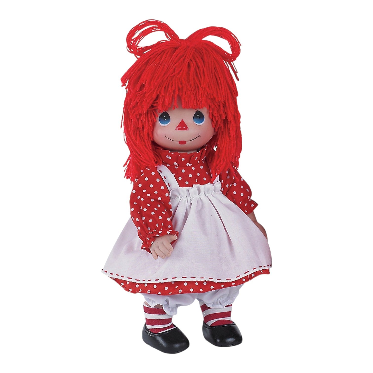 The Doll Maker 12-inch Raggedy Ann vinyl doll with red yarn hair wearing a red polka dot dress and white apron.