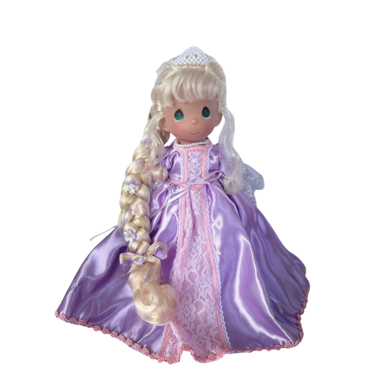 The Doll Maker 12-inch Rapunzel doll with long blonde braided hair wearing a purple satin gown with lace trim