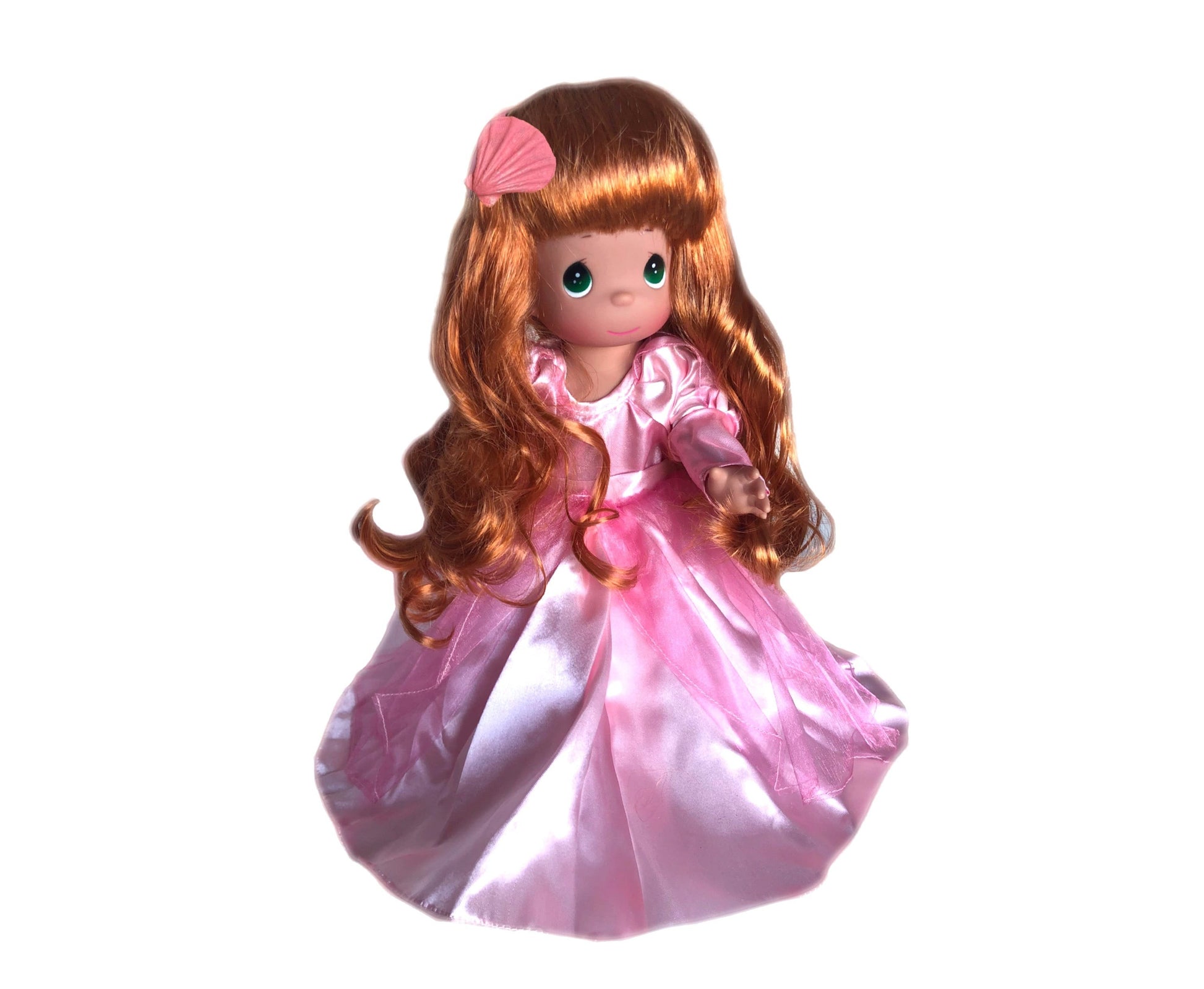 A 12-inch doll with long red hair in a pink dress, commonly identified as Sweet Dreamer.