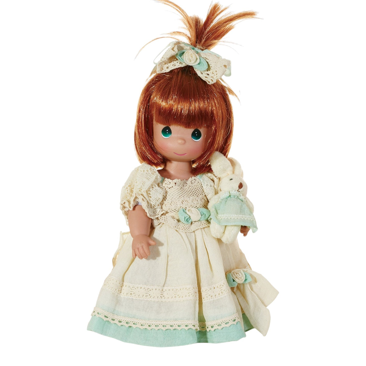 The Doll Maker Ryleigh 12-inch vinyl doll with red hair, wearing a cream lace dress and holding a small plush bunny.